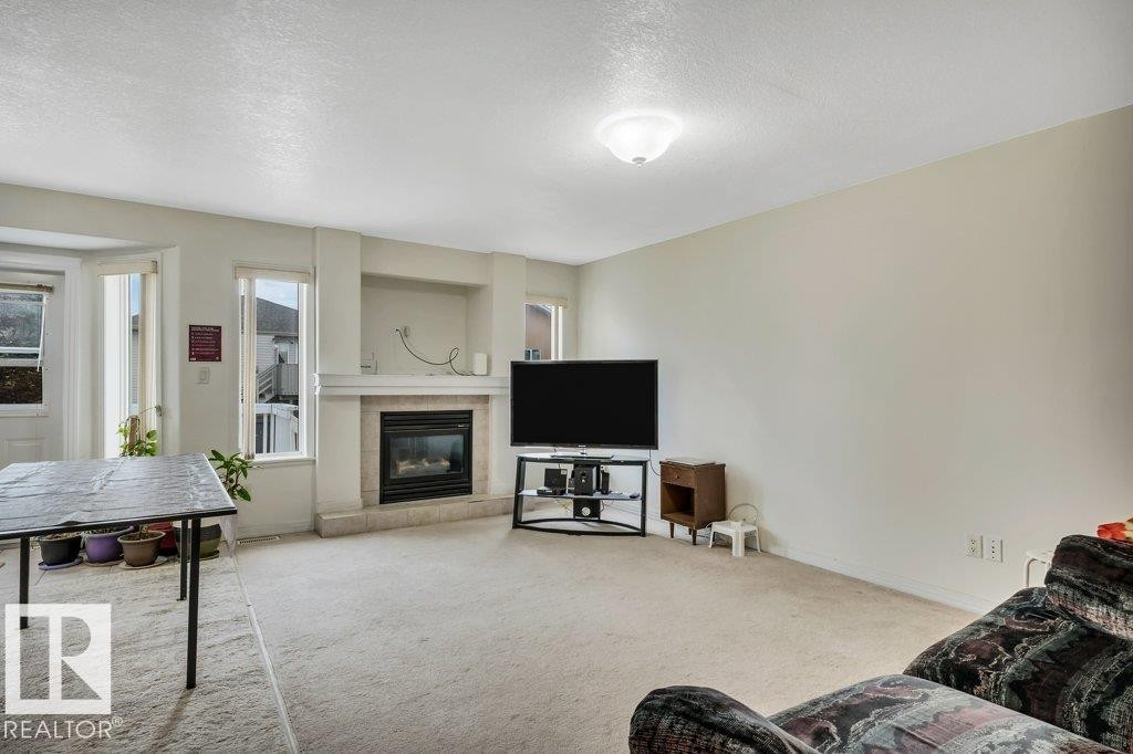 3135 34B Avenue Nw, Edmonton, AB - Indoor Photo Showing Living Room With Fireplace