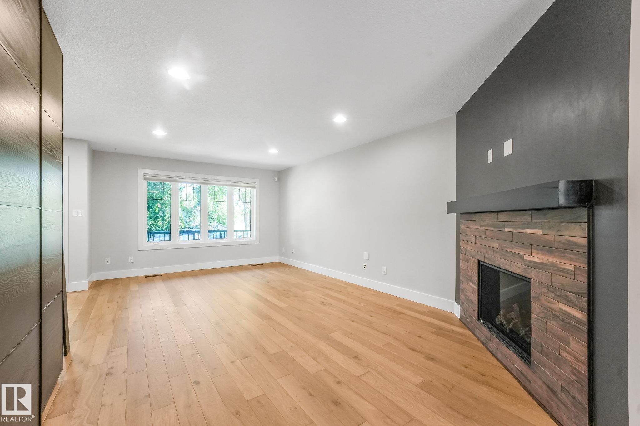 10433 70 Avenue Nw, Edmonton, AB - Indoor Photo Showing Other Room With Fireplace