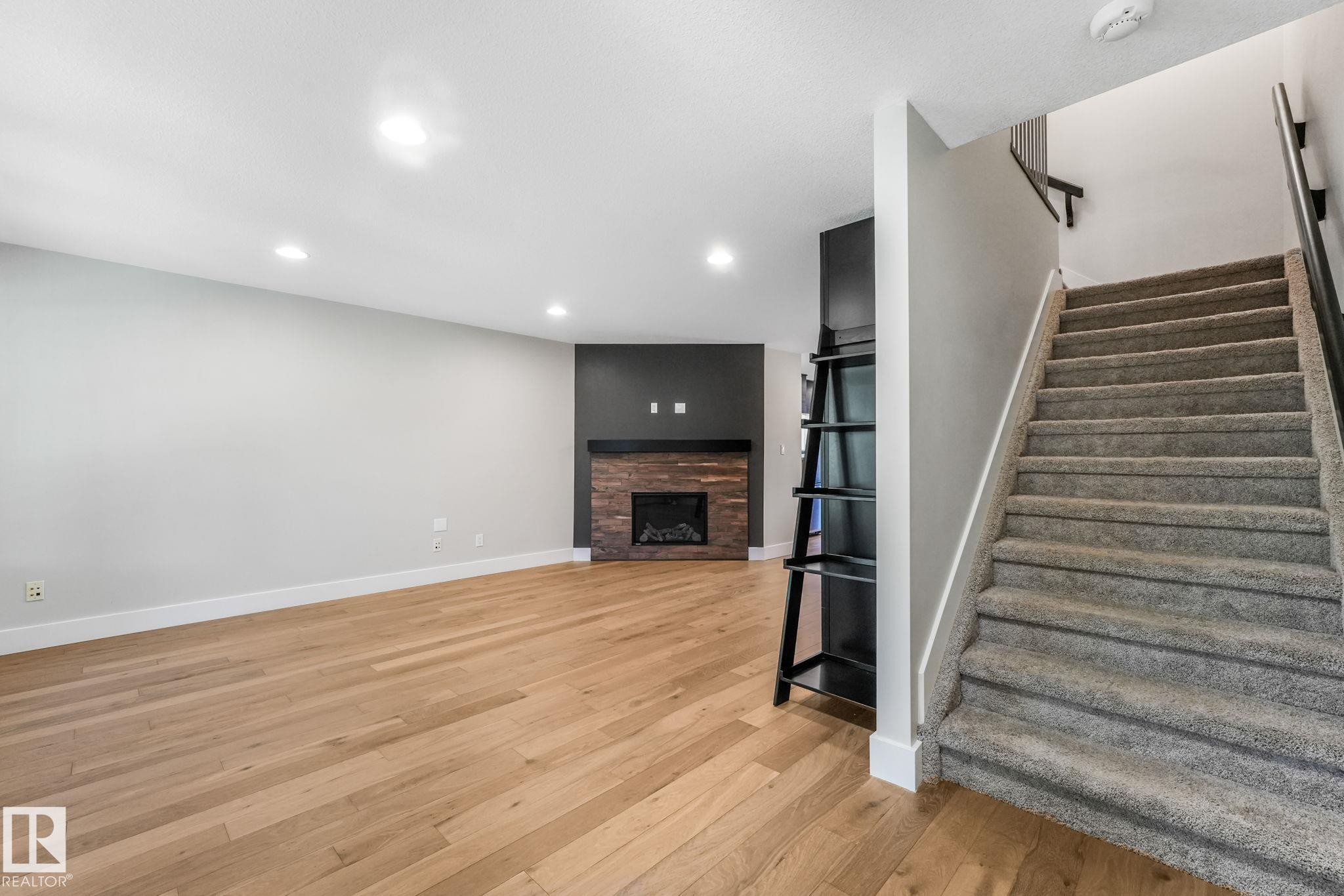 10433 70 Avenue Nw, Edmonton, AB - Indoor Photo Showing Other Room With Fireplace