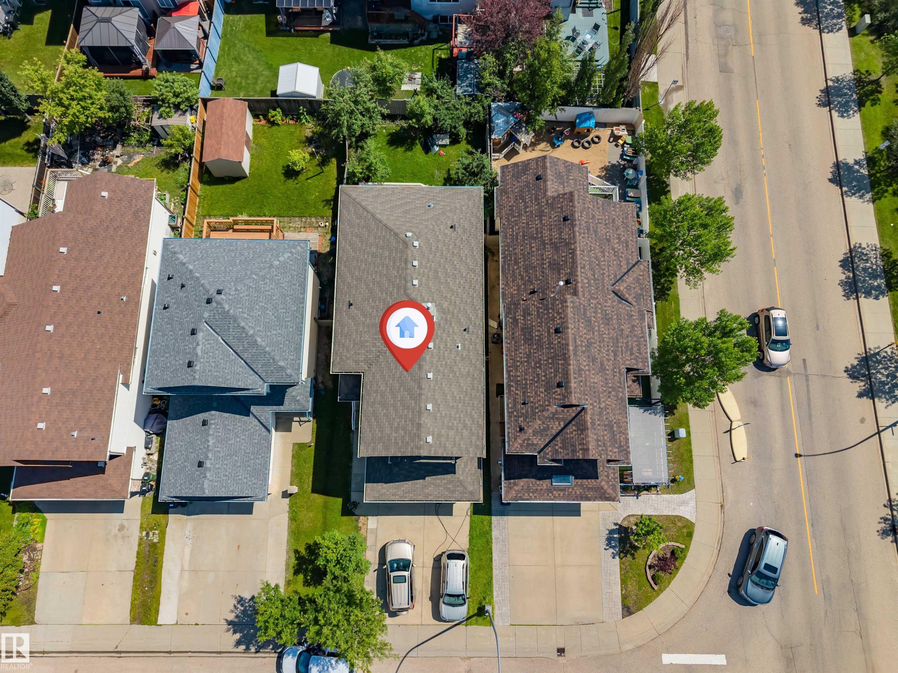 Property with a gray shingled roof and concrete driveway - 16205 55 Street Nw, Edmonton, AB - Outdoor With View