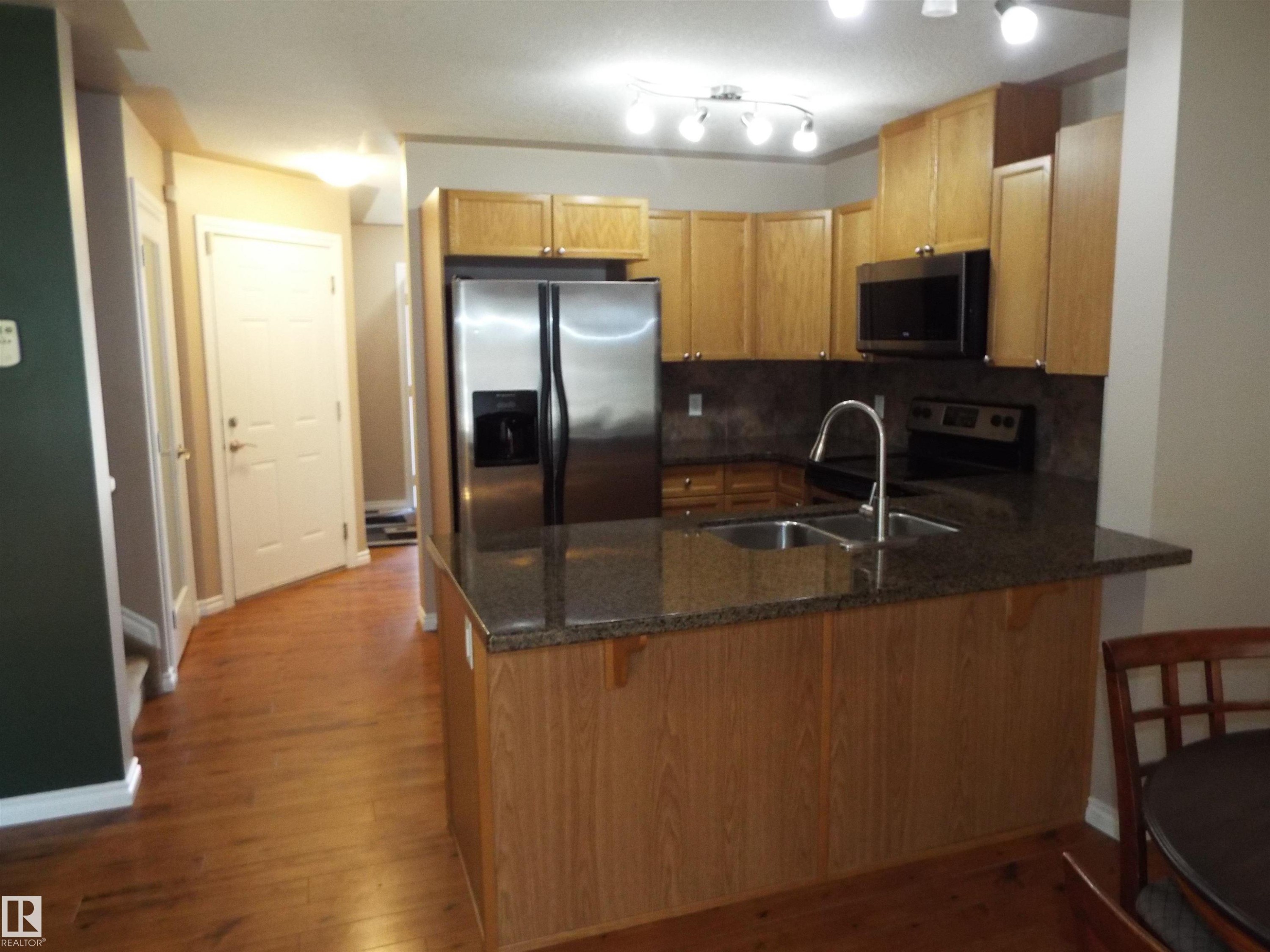 #133 5420 Grant Macewan Bv, Leduc, AB - Indoor Photo Showing Kitchen With Double Sink