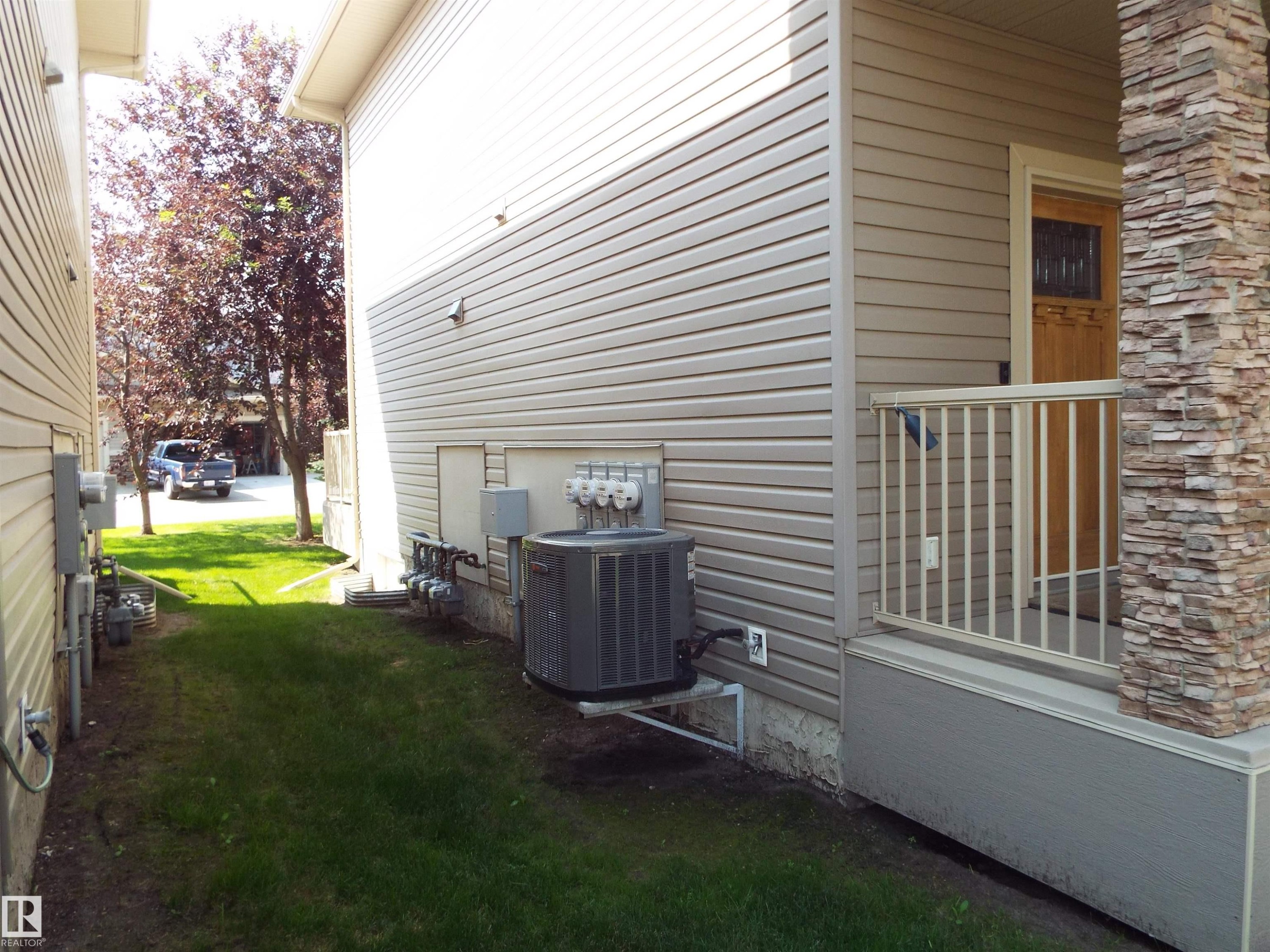 #133 5420 Grant Macewan Bv, Leduc, AB - Outdoor With Deck Patio Veranda With Exterior
