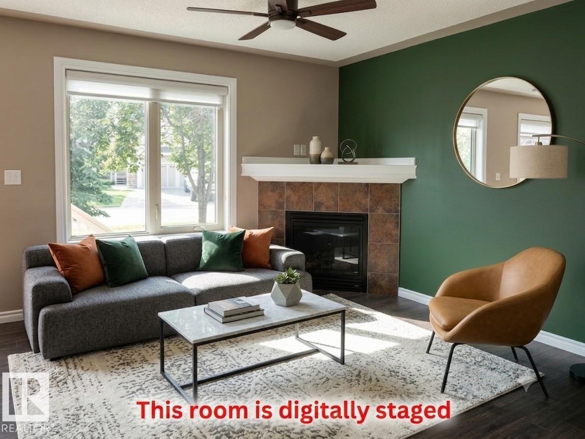 #133 5420 Grant Macewan Bv, Leduc, AB - Indoor Photo Showing Living Room With Fireplace