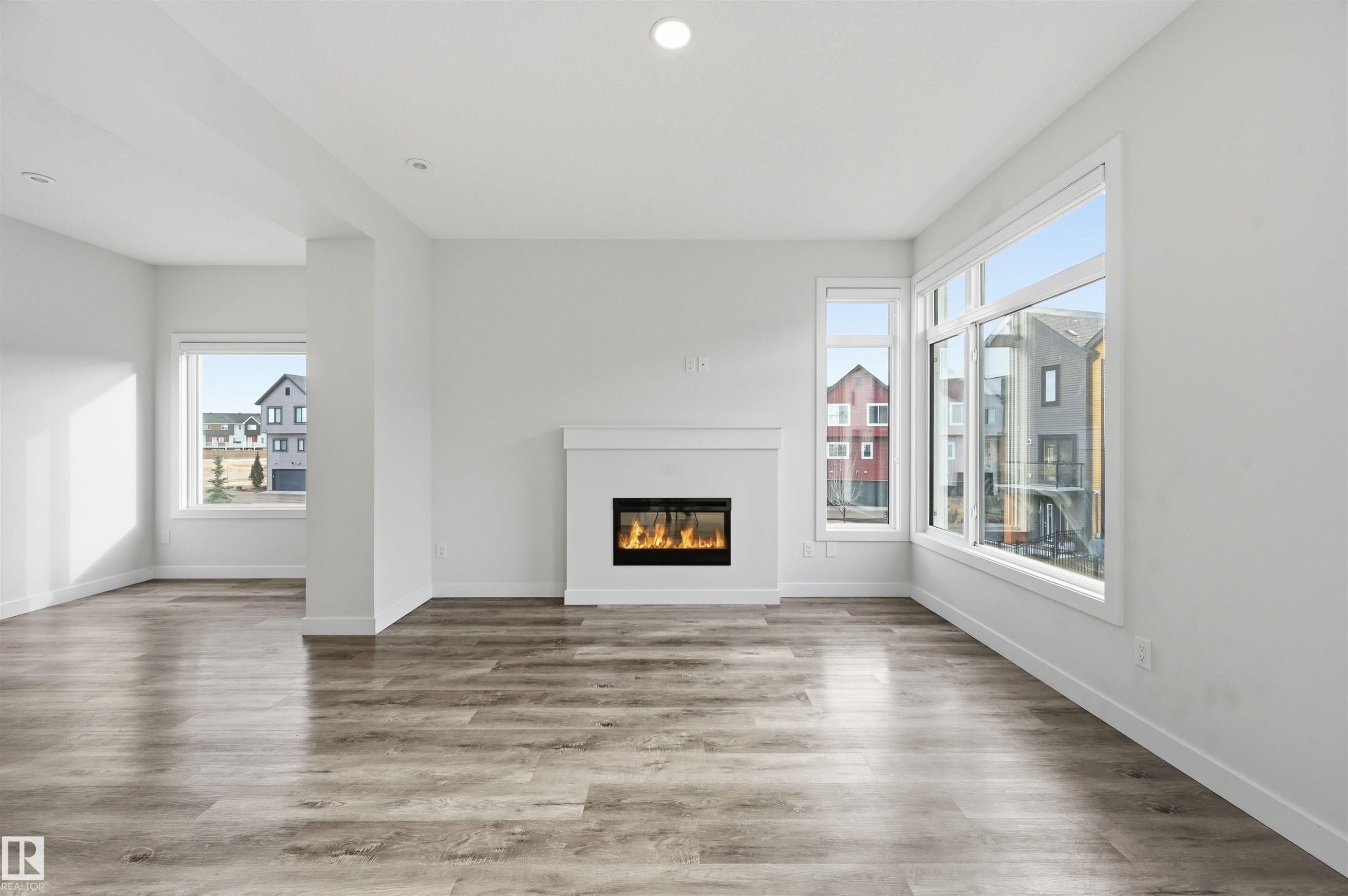 #77 1010 Rabbit Hill Rd Sw, Edmonton, AB - Indoor Photo Showing Living Room With Fireplace