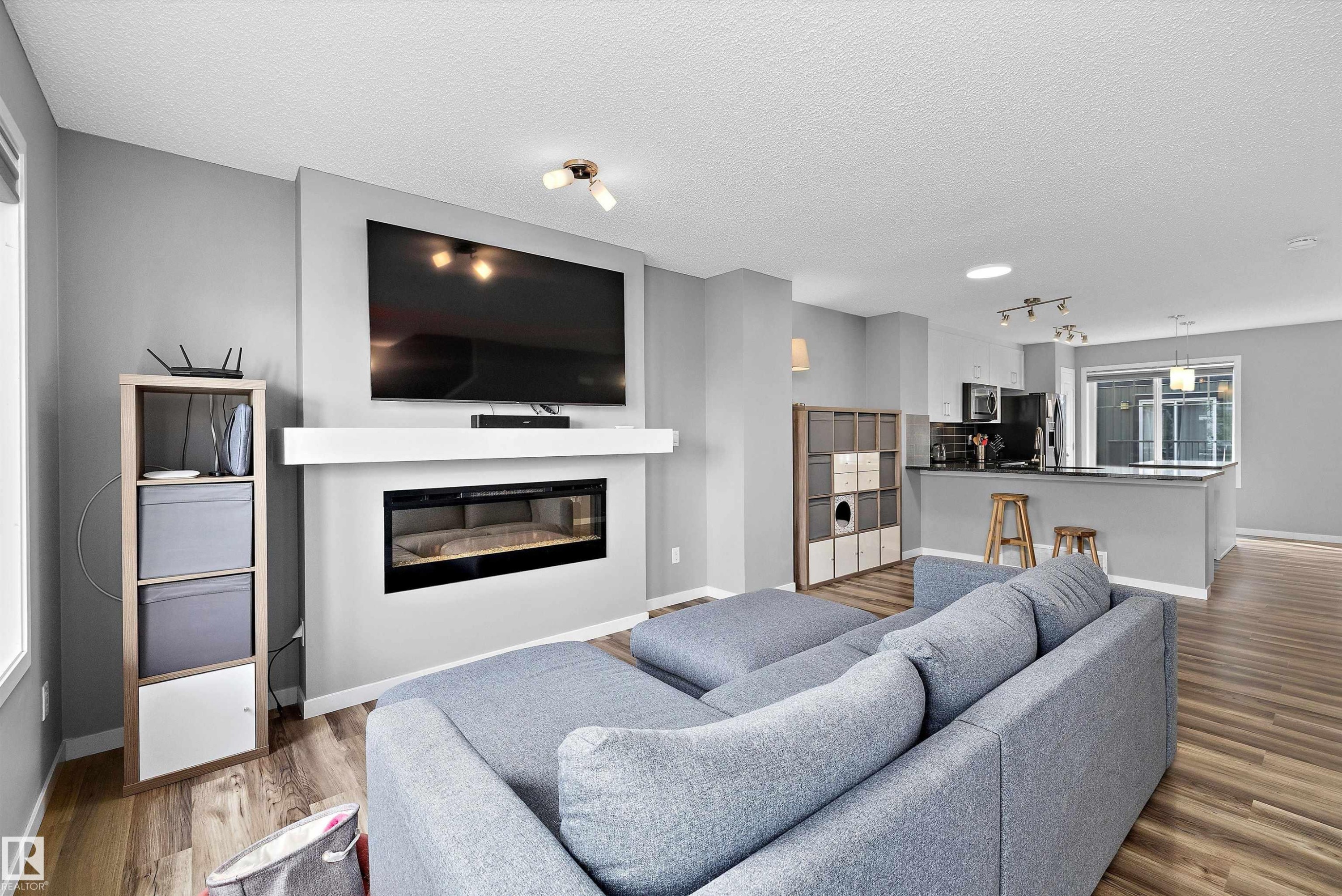 128 3305 Orchards Link, Edmonton, AB - Indoor Photo Showing Living Room With Fireplace