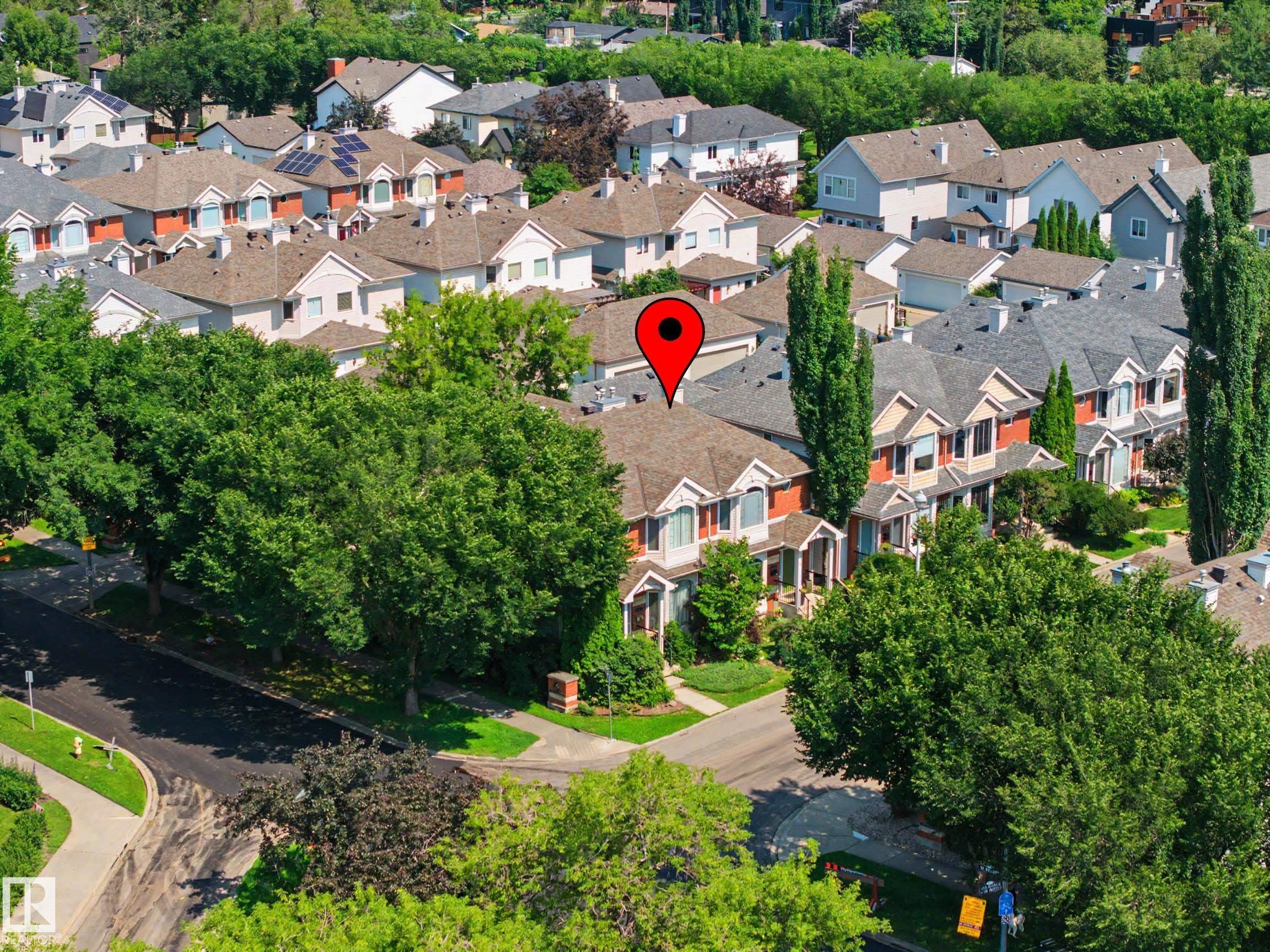 Aerial perspective showcasing a residential neighborhood with varied architectural styles - 9130 100A Avenue Nw, Edmonton, AB - Outdoor
