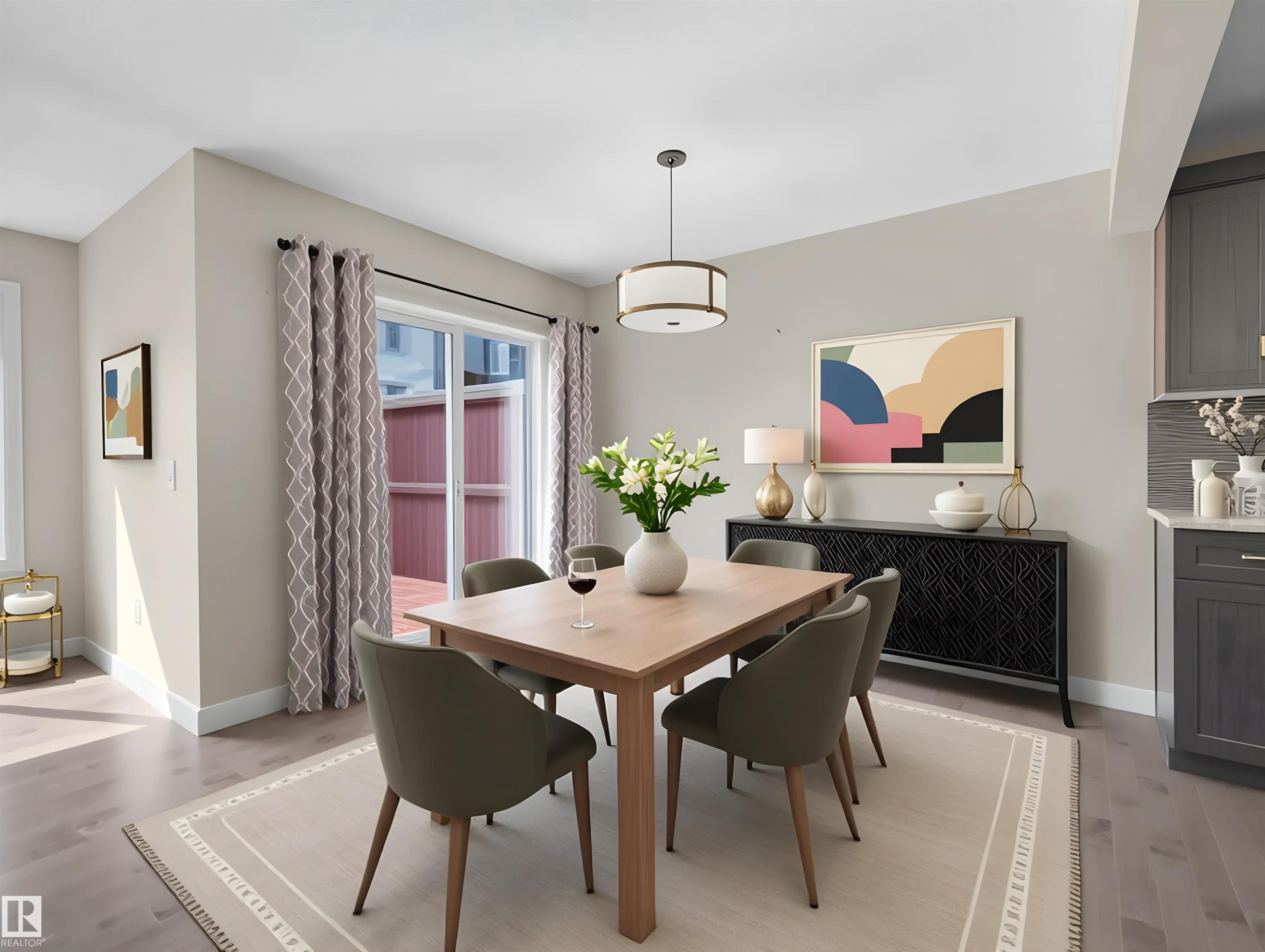Bright dining area featuring light wood-finish flooring and a central lighting fixture - 4487 Annett Common Sw, Edmonton, AB - Indoor Photo Showing Dining Room