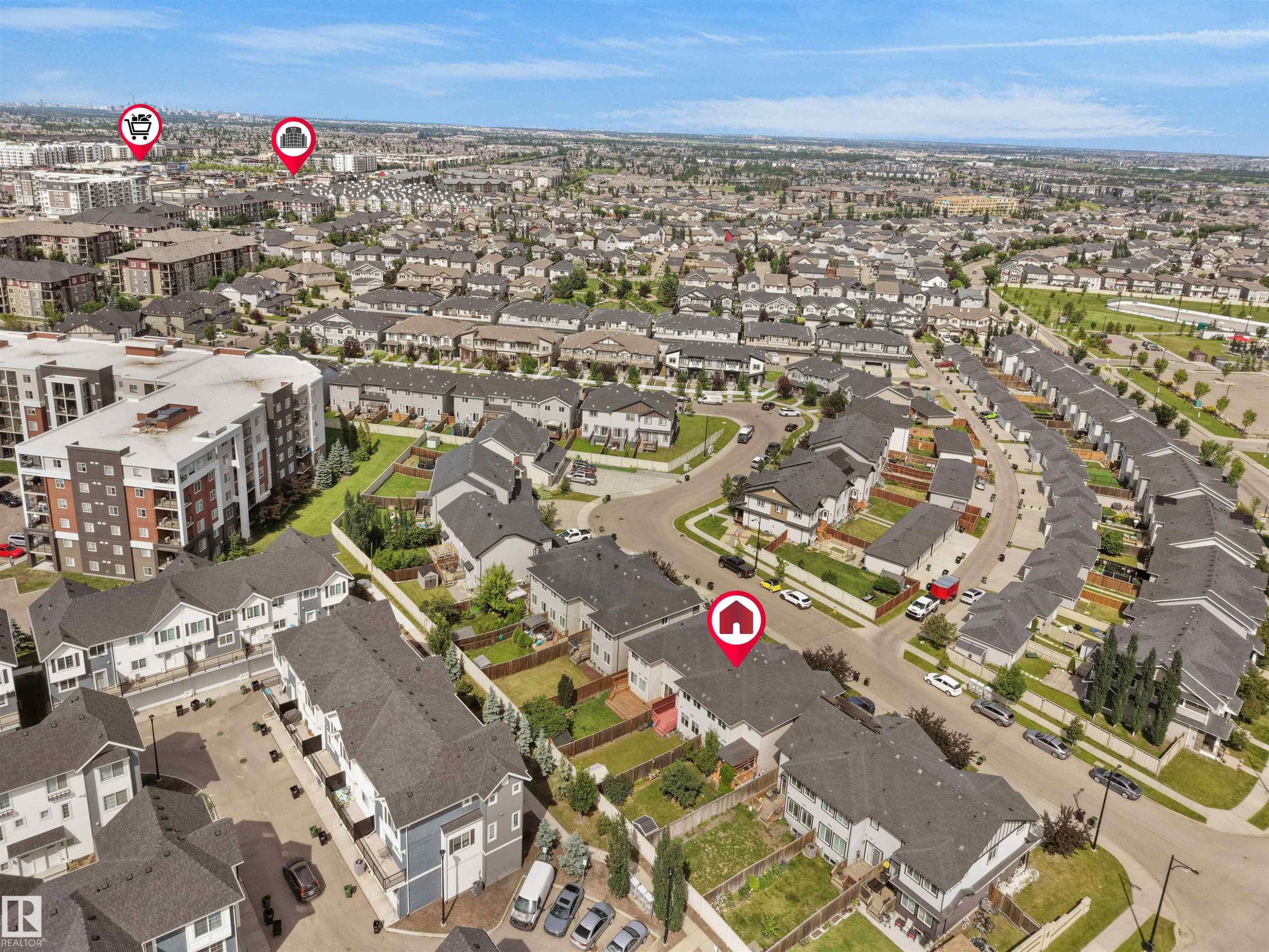 Extensive aerial view showcasing a dense residential community with varied housing types - 4487 Annett Common Sw, Edmonton, AB - With View