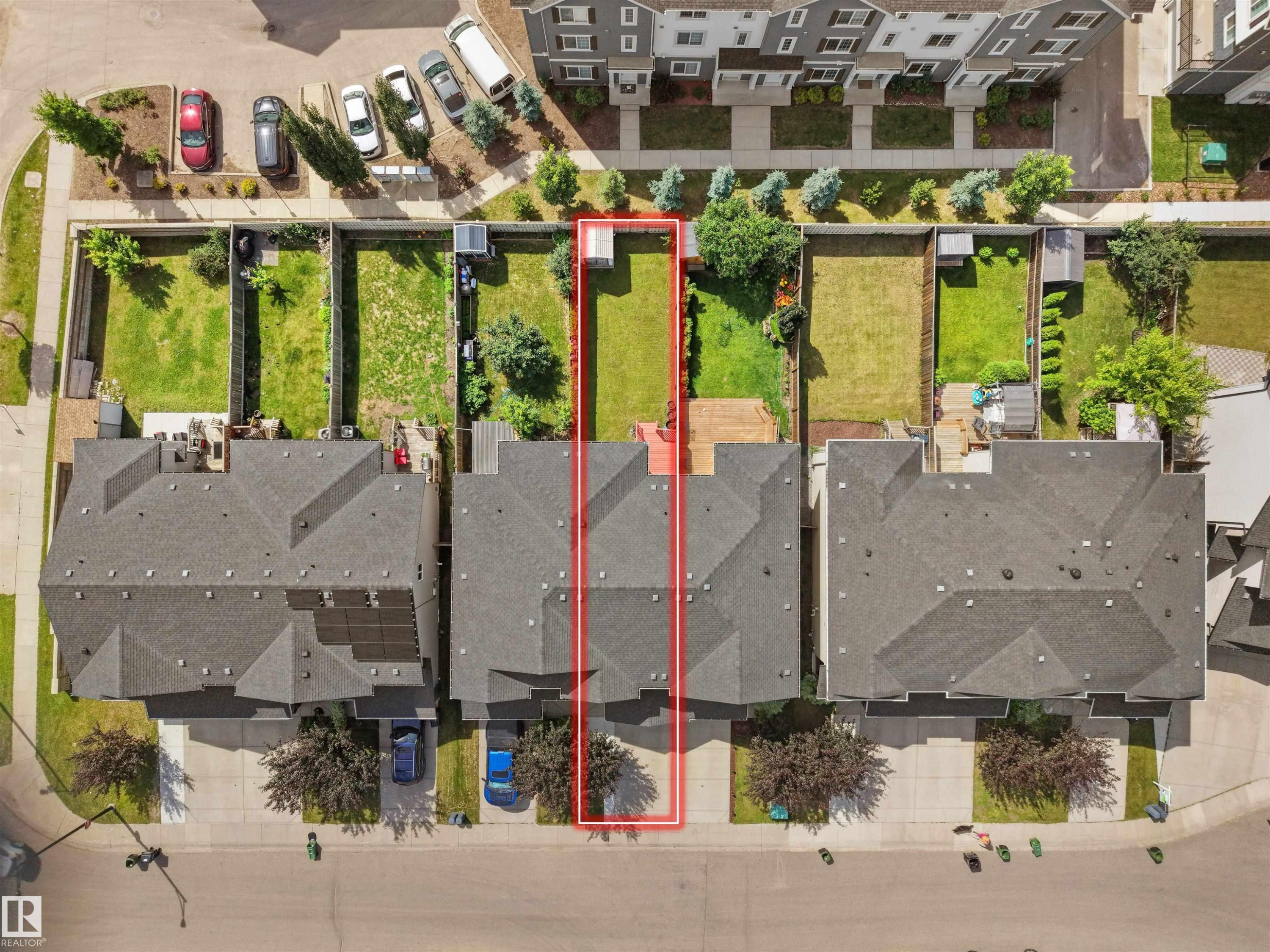 Residential property featuring a grey shingle roof, a paved driveway, and a private rear yard with green space - 4487 Annett Common Sw, Edmonton, AB -