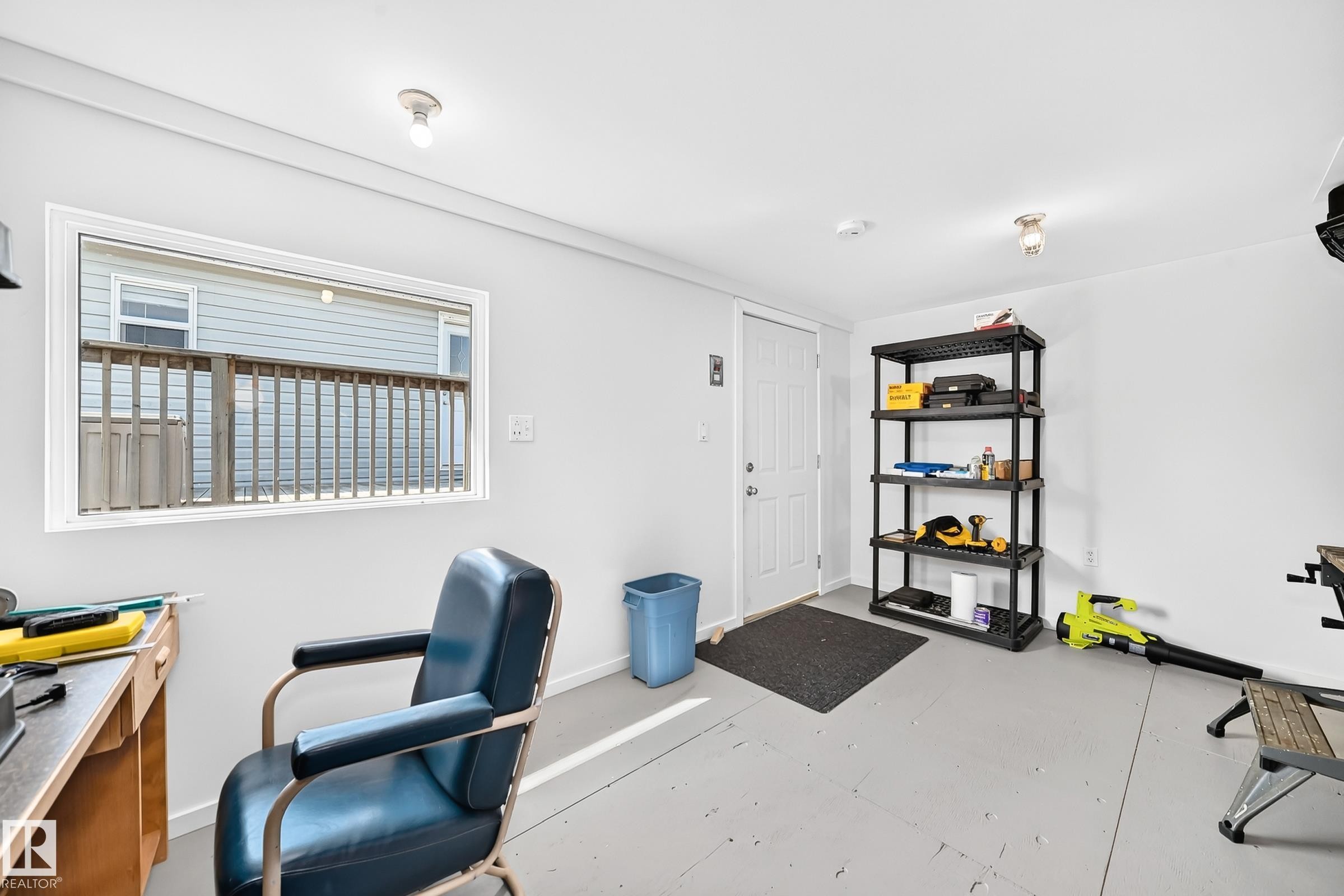 Interior space featuring painted walls and a window with a white frame - #225 3400 48 St, Stony Plain, AB - Indoor Photo Showing Office
