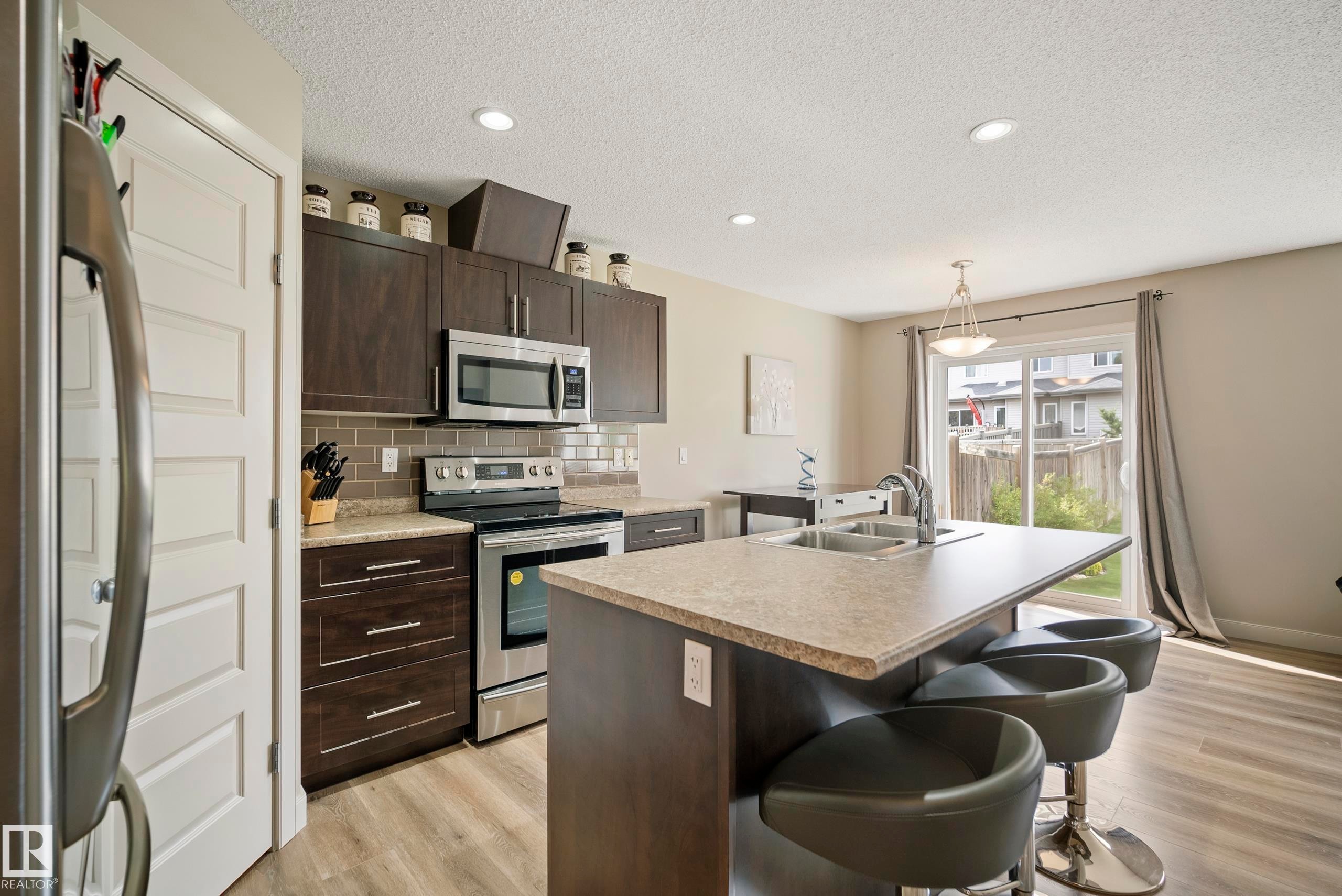 1715 Cunningham Way Sw, Edmonton, AB - Indoor Photo Showing Kitchen With Stainless Steel Kitchen With Double Sink