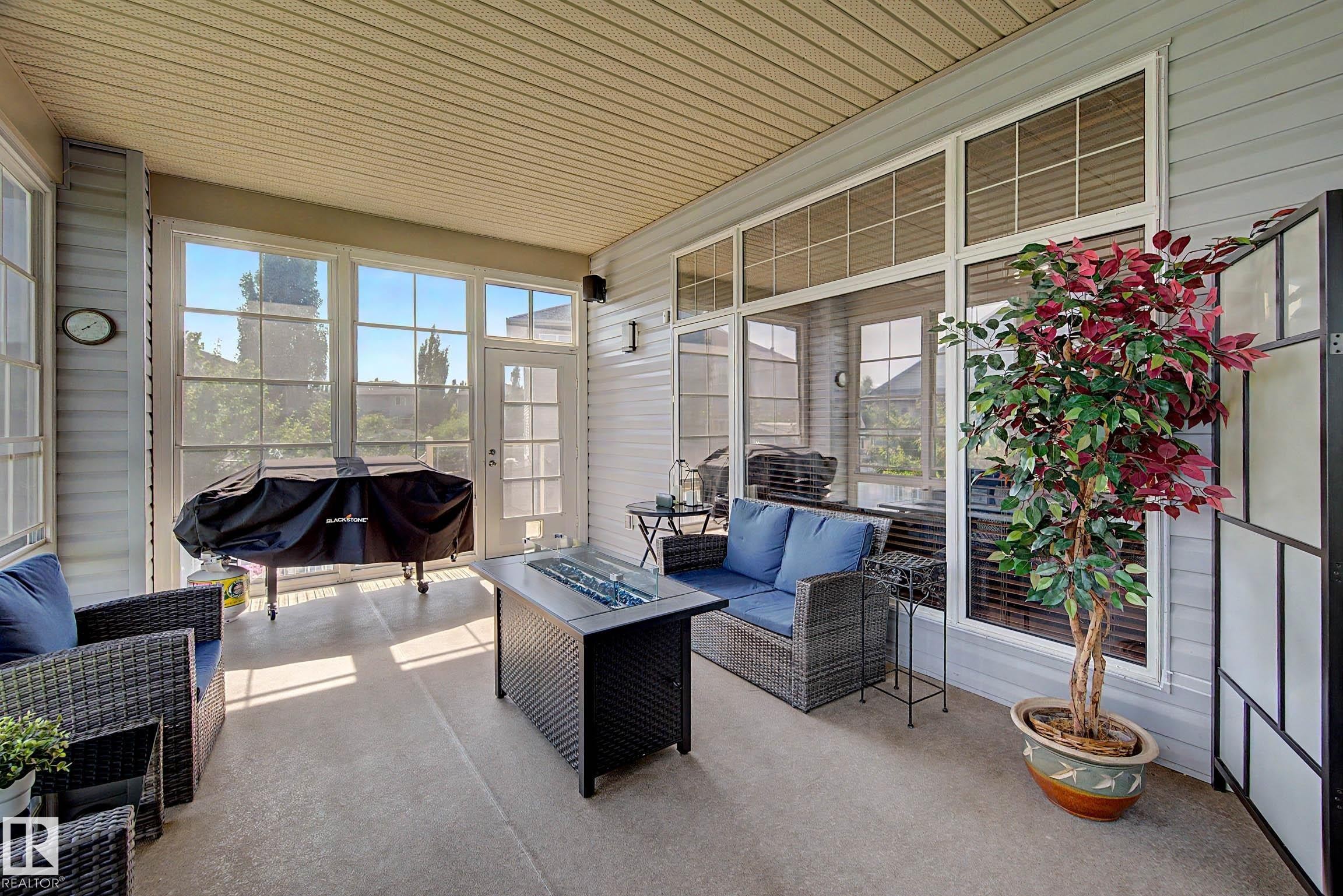 Enclosed patio featuring concrete flooring and a paneled ceiling - 38 Longview Point(E), Spruce Grove, AB - Outdoor With Deck Patio Veranda With Exterior
