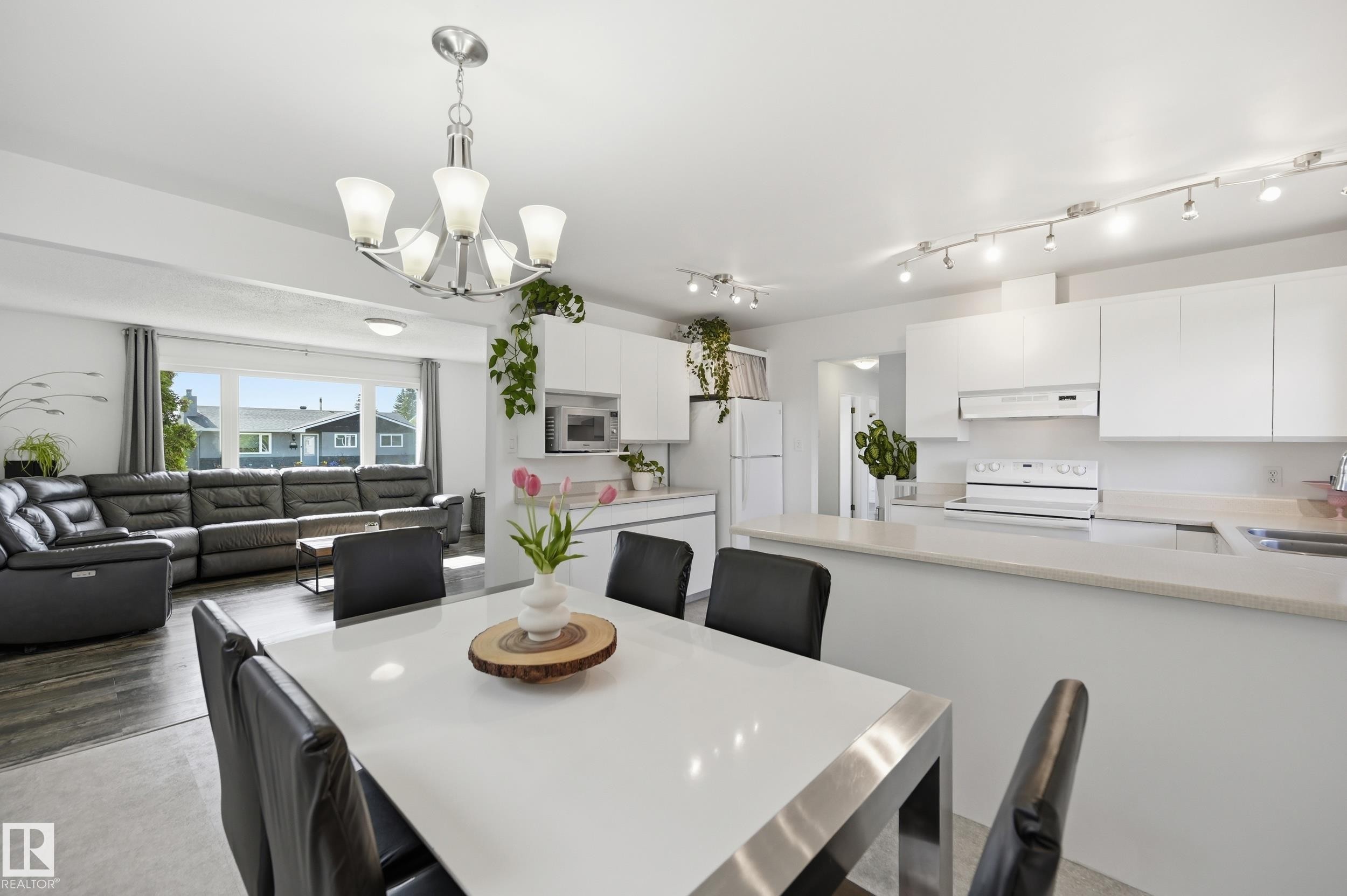 Open-concept living space featuring a dining area, kitchen, and living room - 15111 67 Street Nw, Edmonton, AB - Indoor