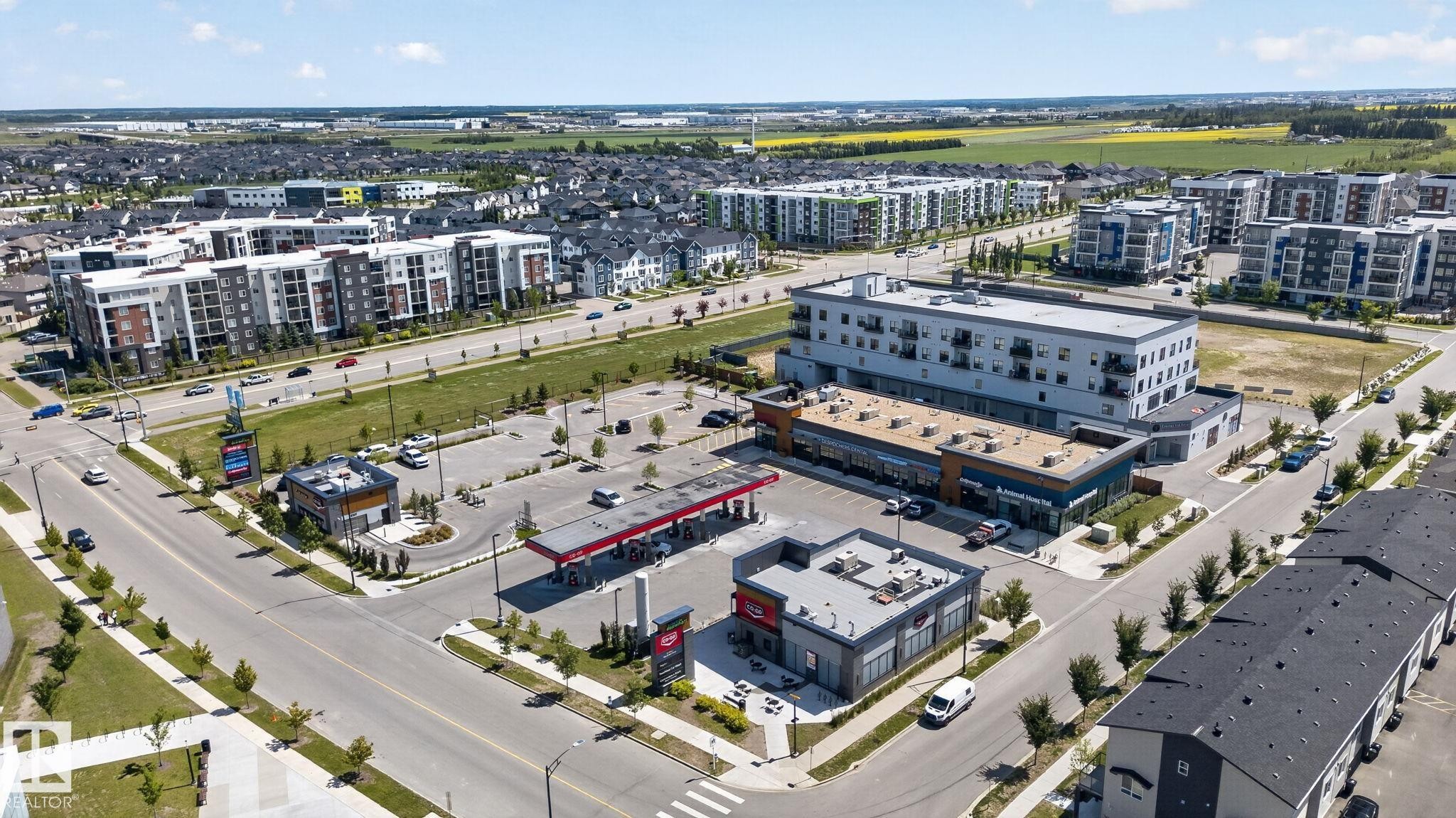Aerial perspective showcasing commercial and residential buildings - 319 Desrochers Boulevard Sw, Edmonton, AB - Outdoor With View