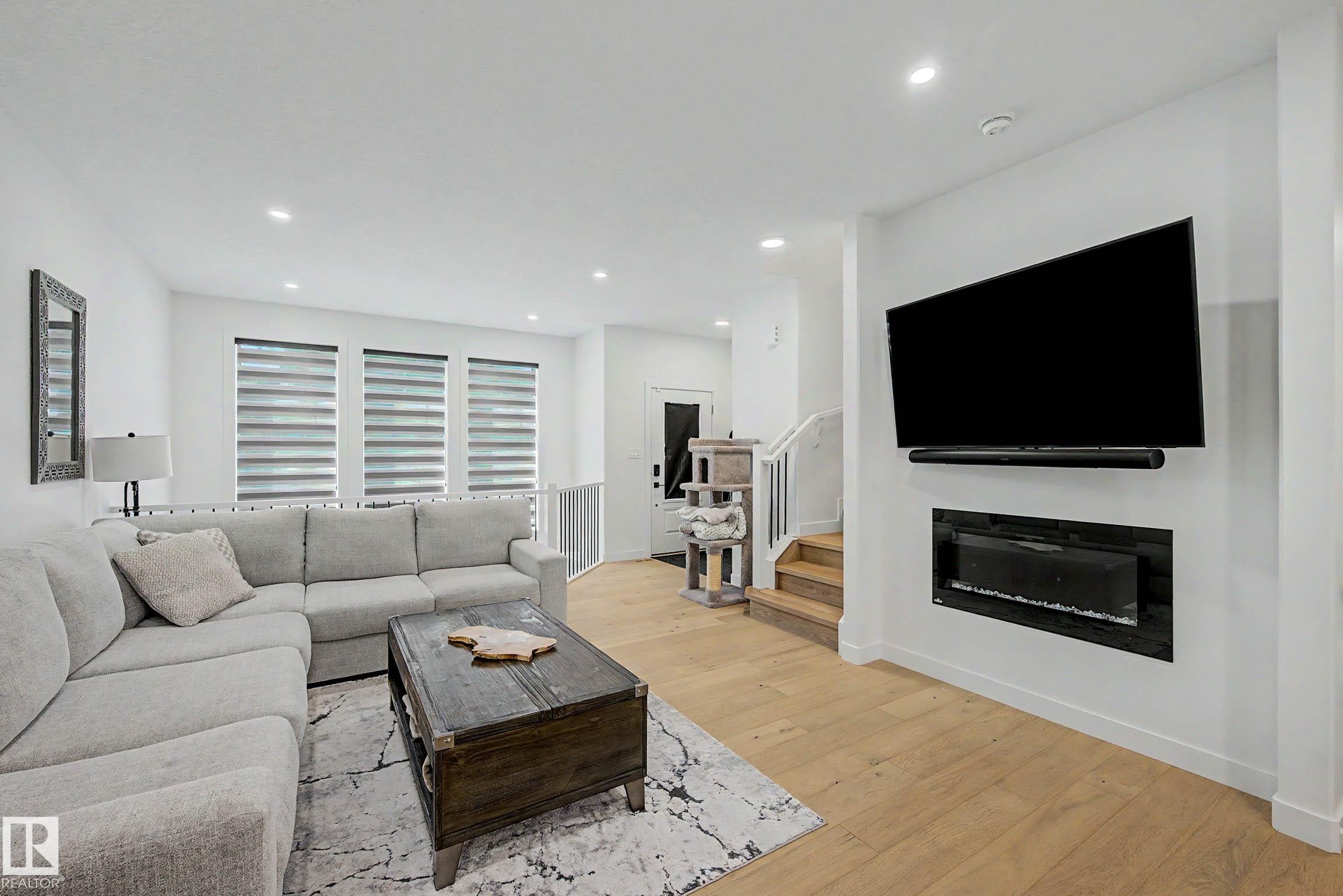 3363 Orchards Link Link Sw, Edmonton, AB - Indoor Photo Showing Living Room With Fireplace