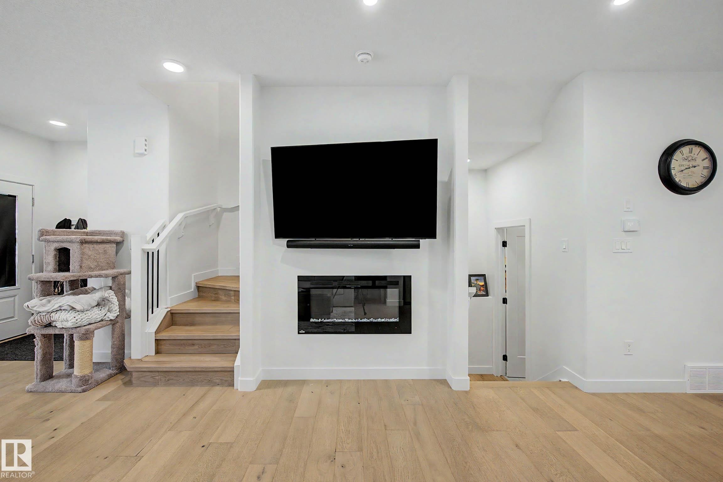 3363 Orchards Link Link Sw, Edmonton, AB - Indoor Photo Showing Living Room With Fireplace