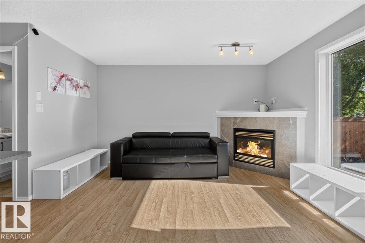 Sitting room - #18 345 Kirkness Rd Nw, Edmonton, AB - Indoor Photo Showing Living Room With Fireplace