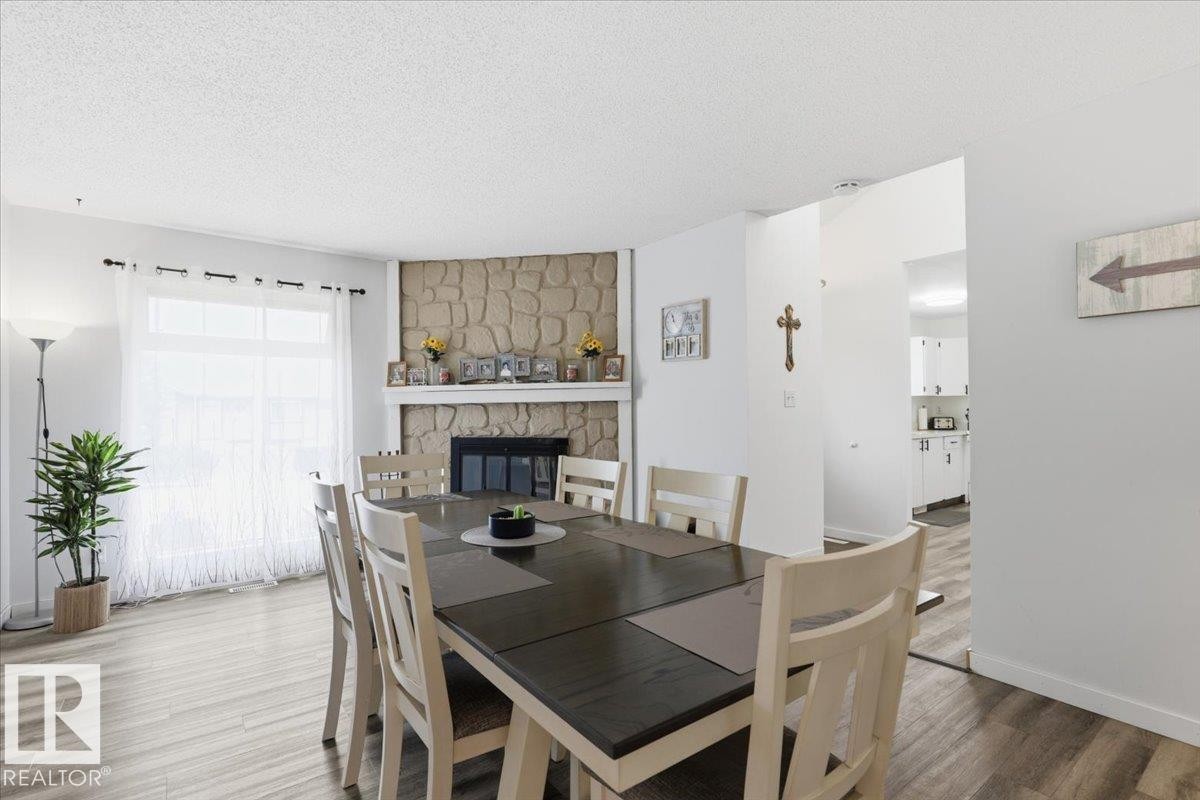 116 Cameron Crescent, Wetaskiwin, AB - Indoor Photo Showing Dining Room With Fireplace