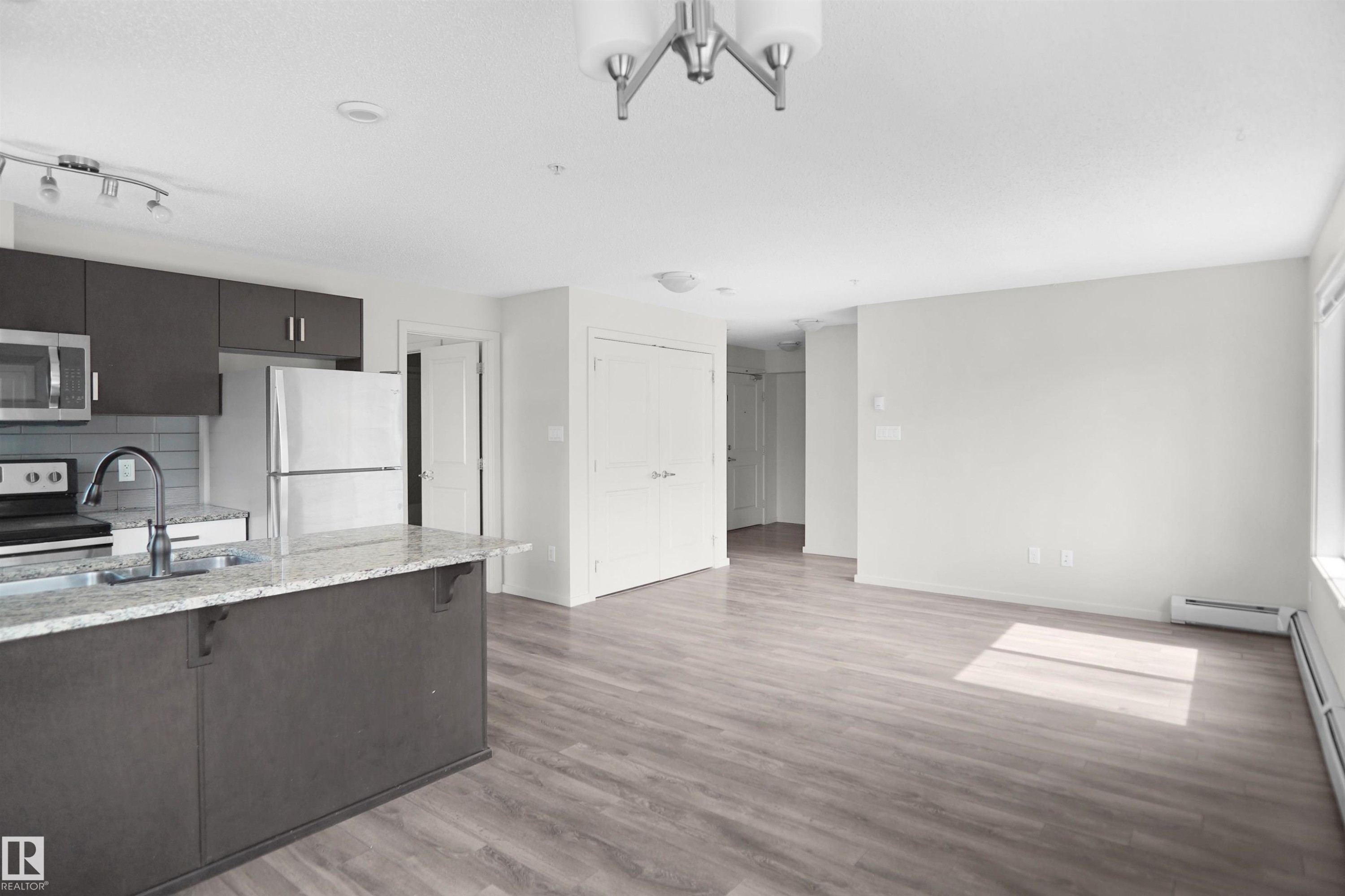 #202 142 Ebbers Bv Nw, Edmonton, AB - Indoor Photo Showing Kitchen With Double Sink