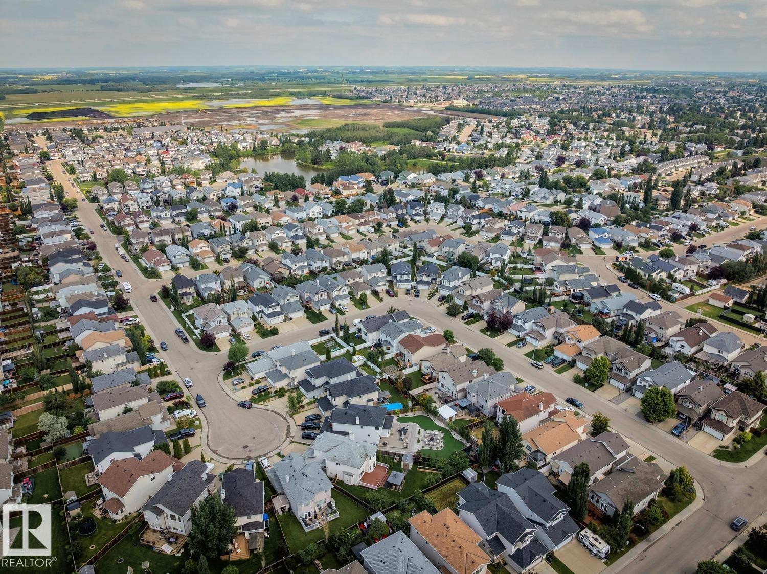 Aerial perspective showcasing a residential neighborhood with varied architectural styles - 16765 119 Street Nw, Edmonton, AB