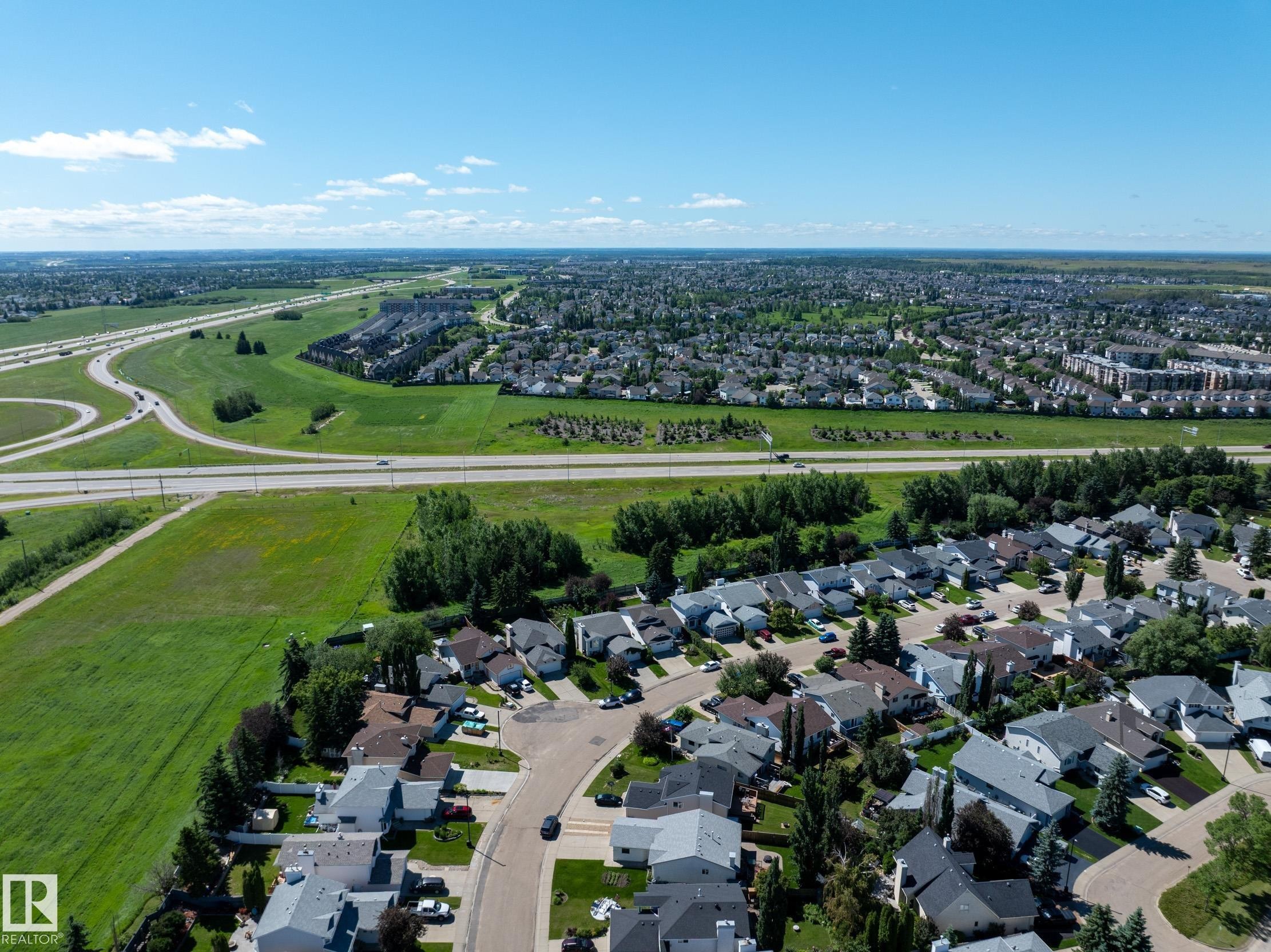 Expansive aerial capturing a suburban neighborhood with varied housing styles - 337 Pearson Crescent Nw, Edmonton, AB - Outdoor With View