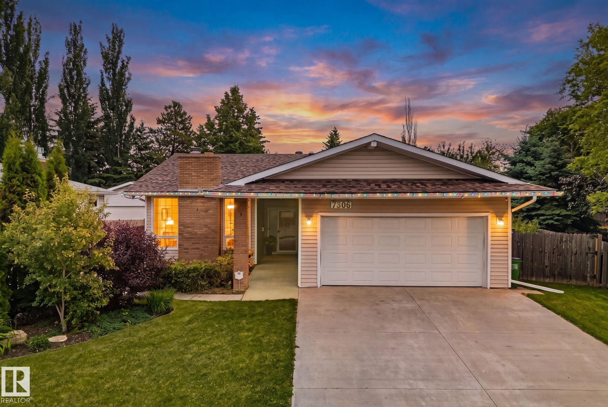 Ranch-style residence featuring a brick facade, attached two-car garage, and a concrete driveway - 7306 21 Avenue Nw, Edmonton, AB - Outdoor
