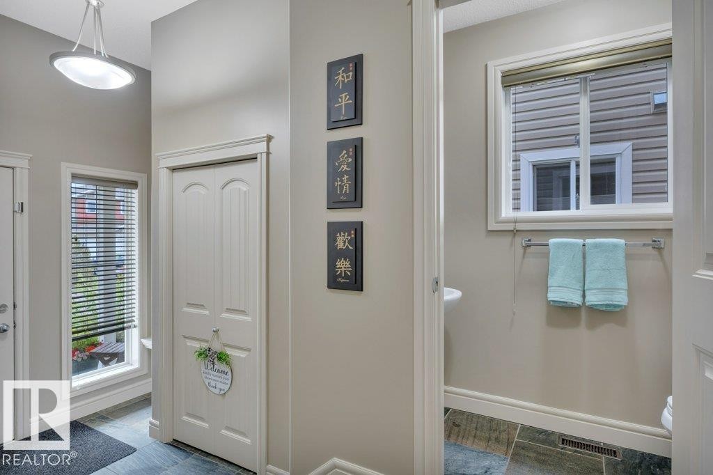 Front entrance and 2-pc. bath - #10 15151 43 St Nw, Edmonton, AB - Indoor Photo Showing Other Room