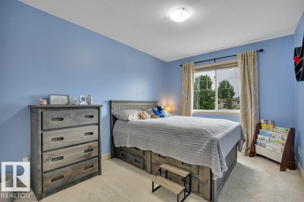 Spacious 2nd bedroom - East facing window - #10 15151 43 St Nw, Edmonton, AB - Indoor Photo Showing Bedroom