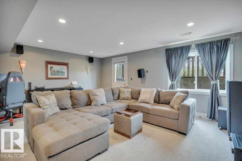 Finished basement family room leading to walkout patio - #10 15151 43 St Nw, Edmonton, AB - Indoor Photo Showing Living Room