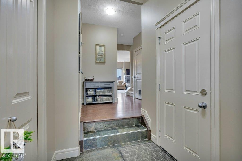 Sunken entrance - looking toward main living area - #10 15151 43 St Nw, Edmonton, AB - Indoor Photo Showing Other Room