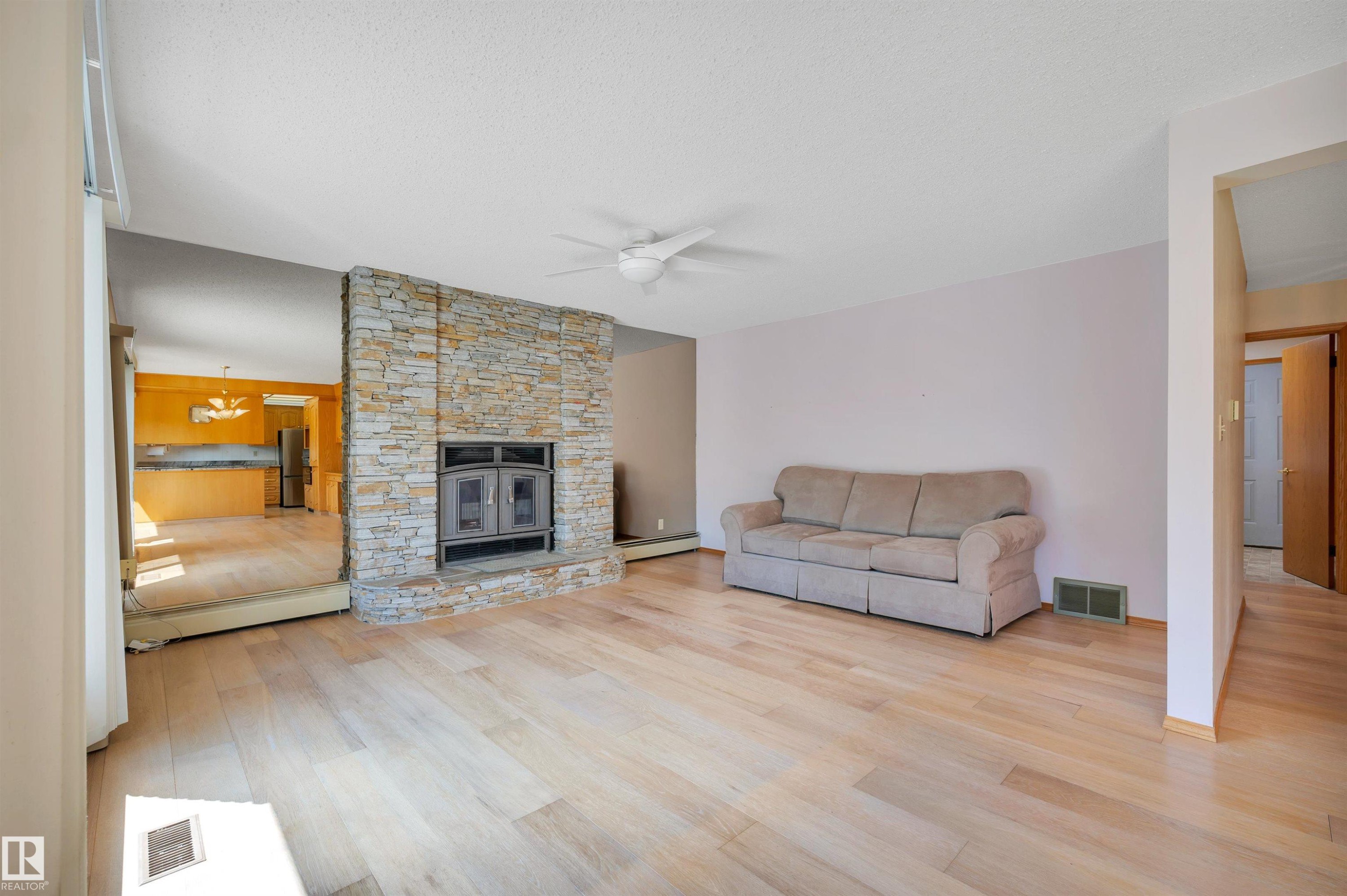 10155 74 Street Nw, Edmonton, AB - Indoor Photo Showing Living Room With Fireplace