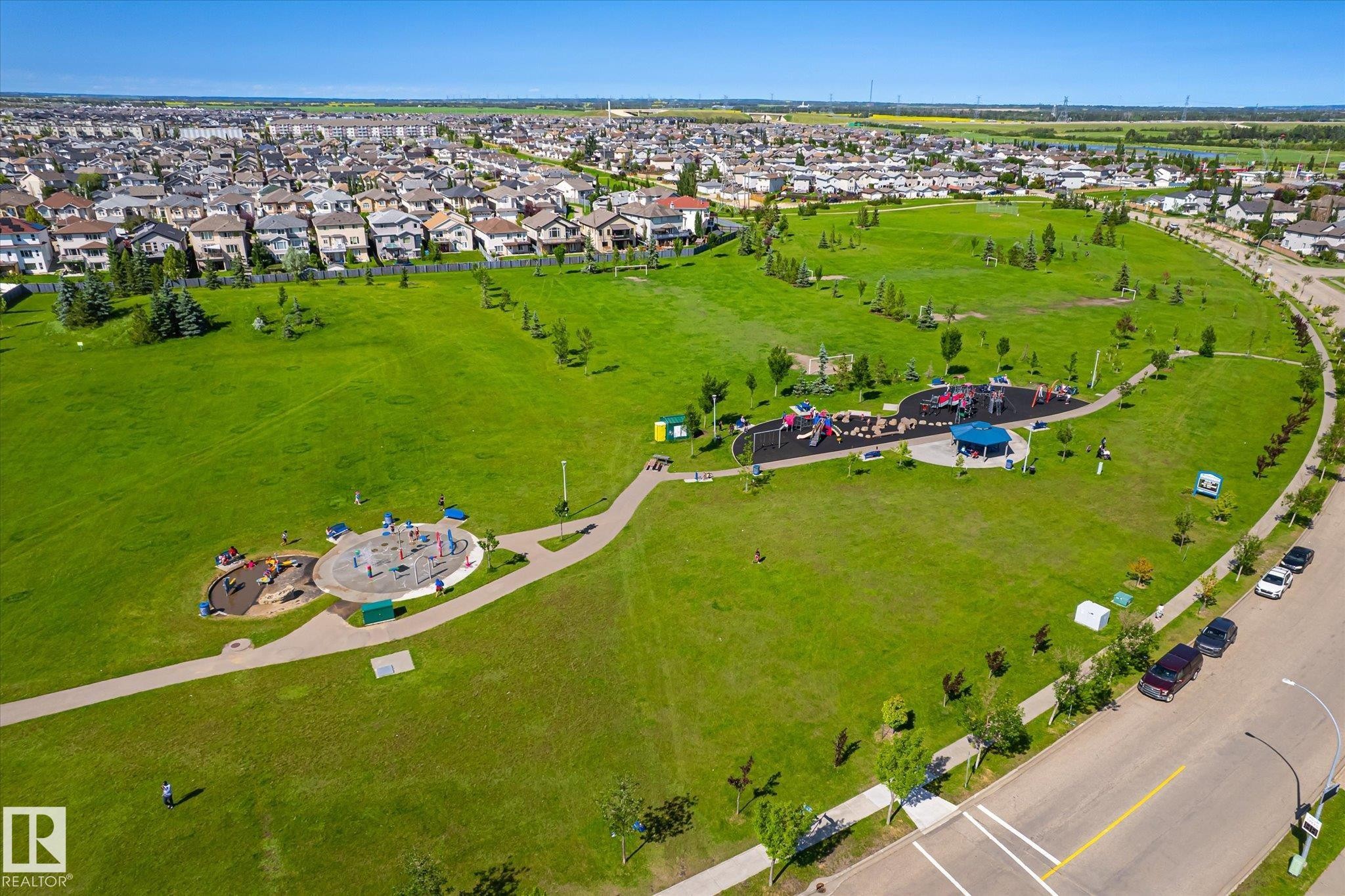 Expansive green space featuring multiple recreational areas, walking paths, and mature trees - 4317 152 Avenue Nw, Edmonton, AB - Outdoor With View