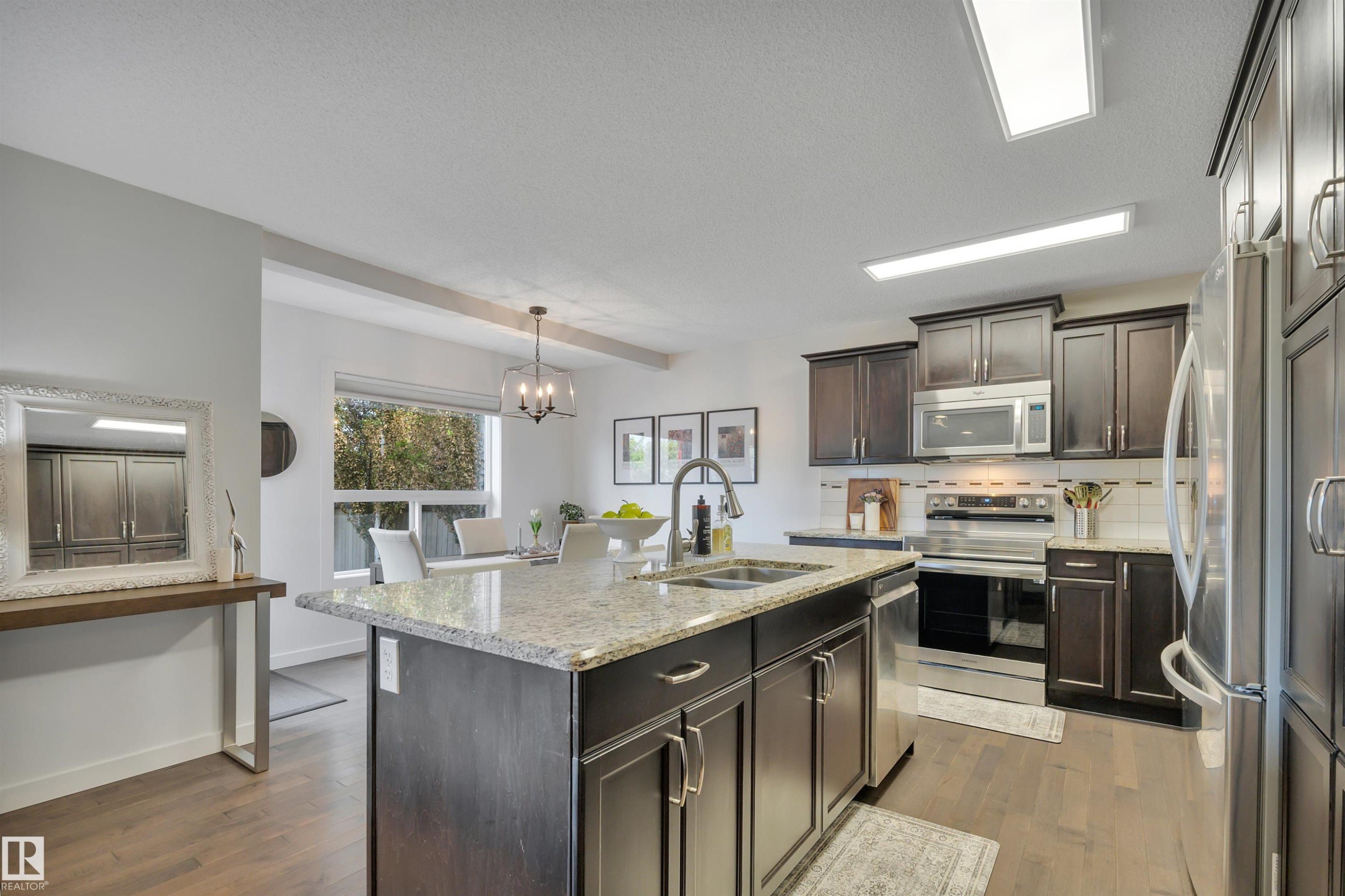 4029 Alexander Way Sw, Edmonton, AB - Indoor Photo Showing Kitchen With Stainless Steel Kitchen With Double Sink With Upgraded Kitchen