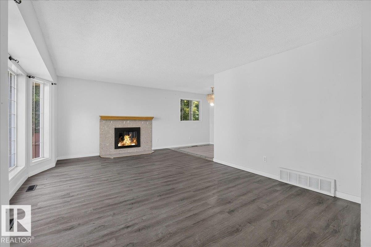 1939 61 Street Nw, Edmonton, AB - Indoor Photo Showing Living Room With Fireplace