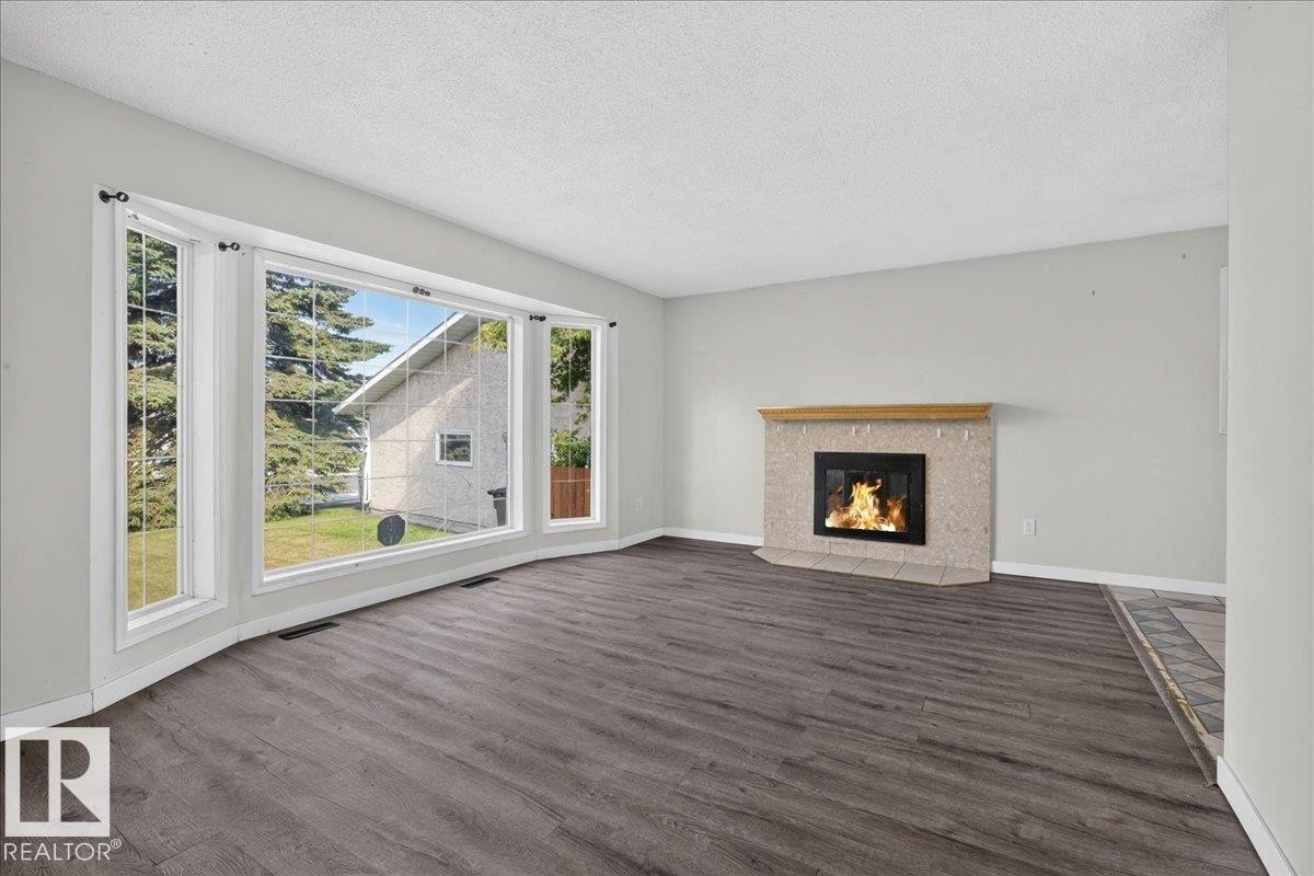 1939 61 Street Nw, Edmonton, AB - Indoor Photo Showing Living Room With Fireplace