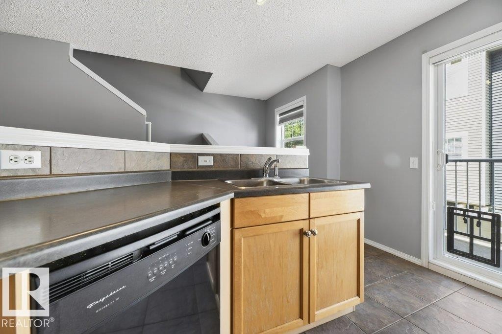 #7 8304 11 Av Sw, Edmonton, AB - Indoor Photo Showing Kitchen With Double Sink