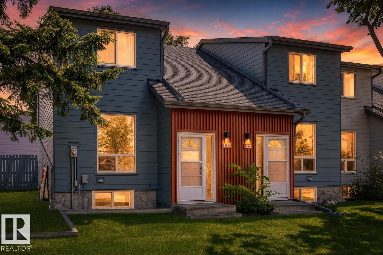 Contemporary multi-level exterior with slate-blue siding and vertical wood-slat accent paneling - 3119 144 Avenue Nw, Edmonton, AB - Outdoor