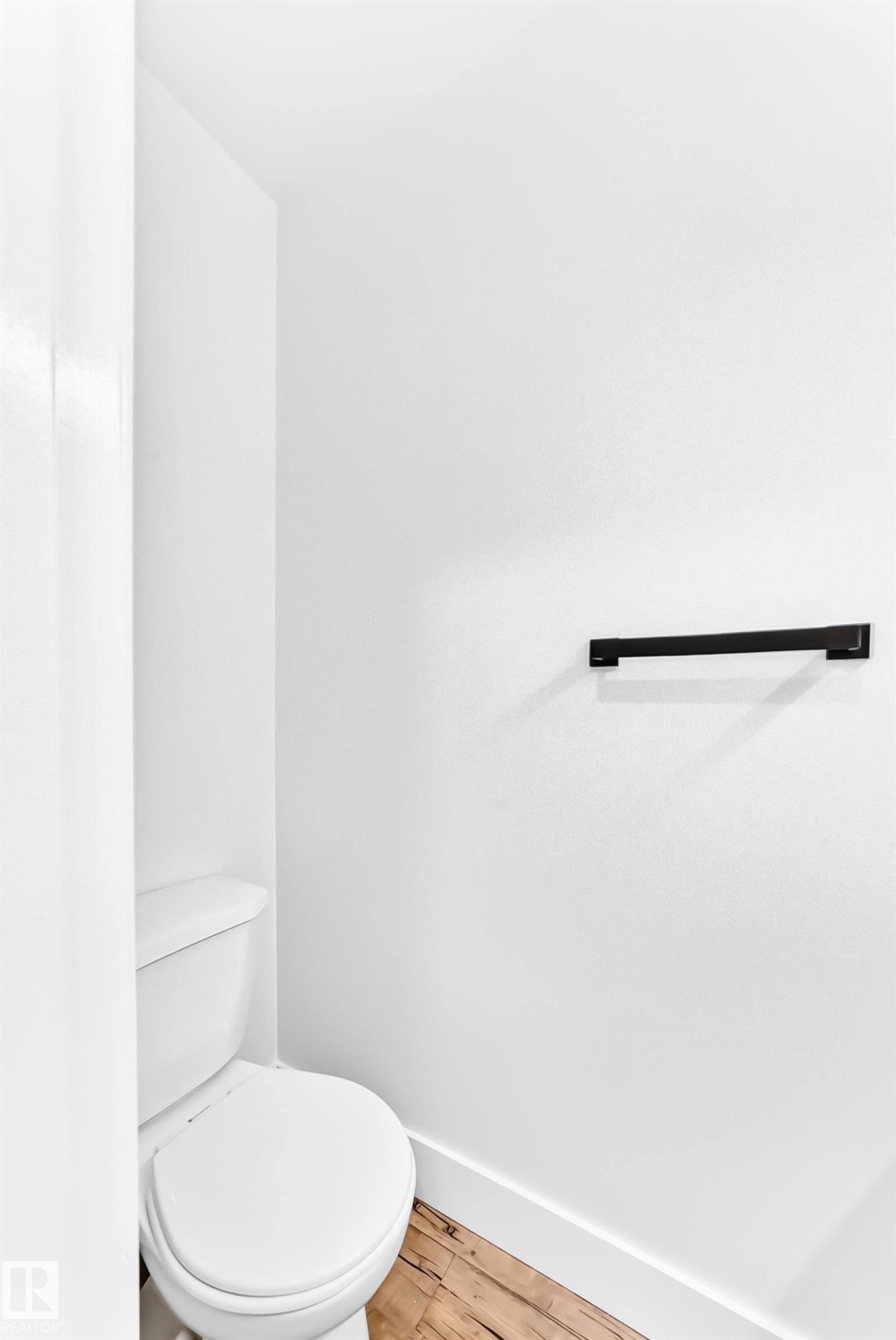 White toilet with a round bowl and tank - 3119 144 Avenue Nw, Edmonton, AB - Indoor Photo Showing Bathroom