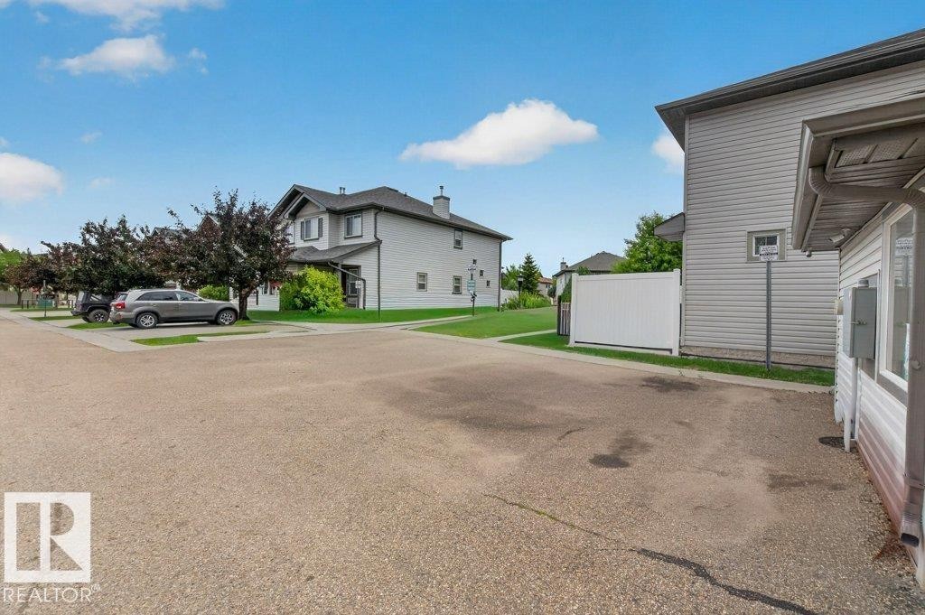 Visitor parking located directly across from the house. - #10 2816 34 Av Nw, Edmonton, AB - Outdoor