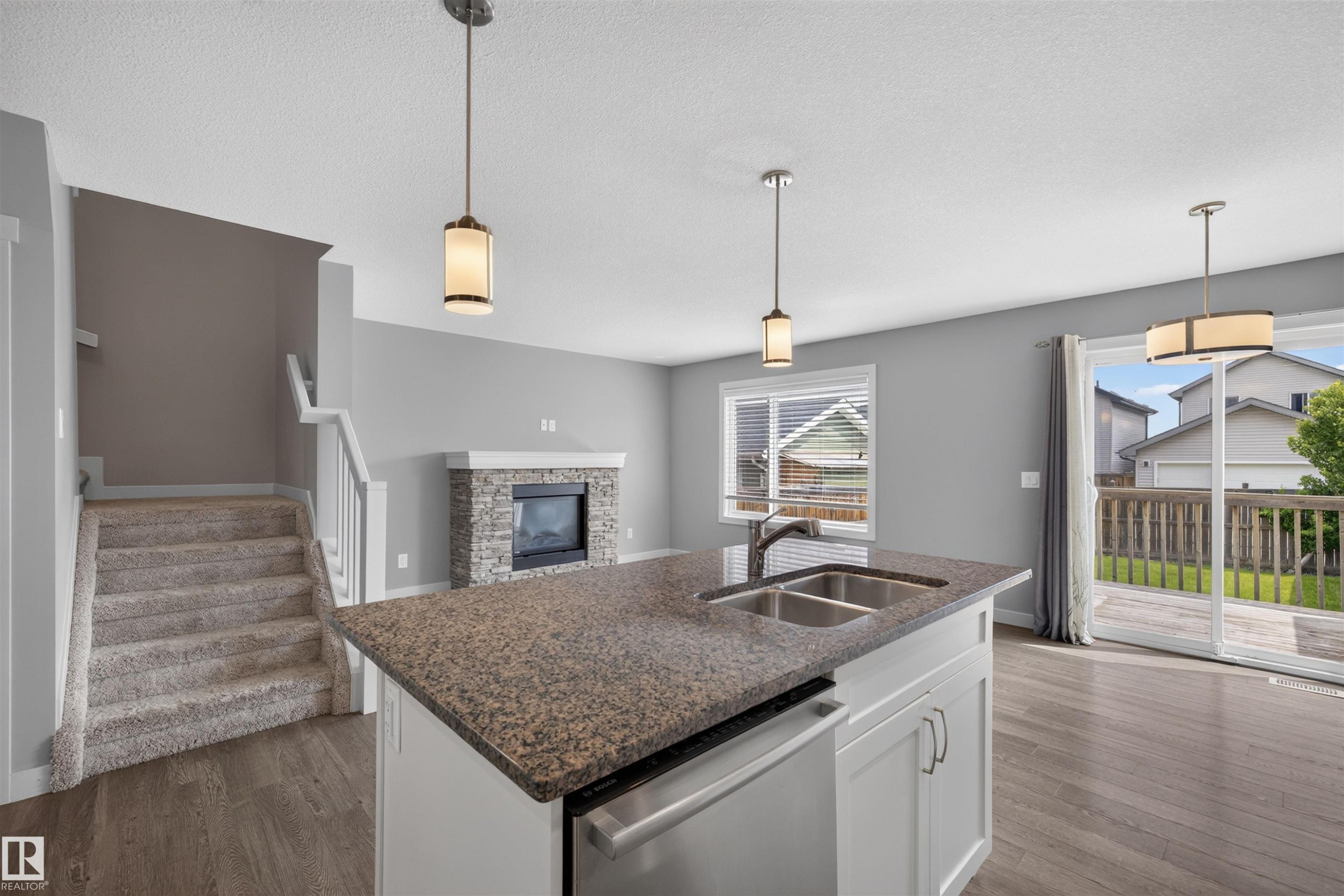 1107 162 Street Sw, Edmonton, AB - Indoor Photo Showing Kitchen With Fireplace With Double Sink