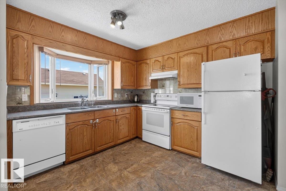 14735 123 Street Nw, Edmonton, AB - Indoor Photo Showing Kitchen With Double Sink