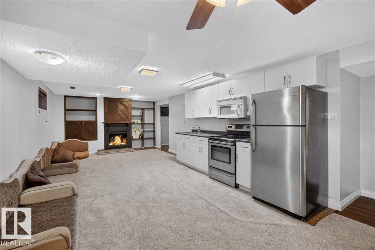 14735 123 Street Nw, Edmonton, AB - Indoor Photo Showing Kitchen With Fireplace
