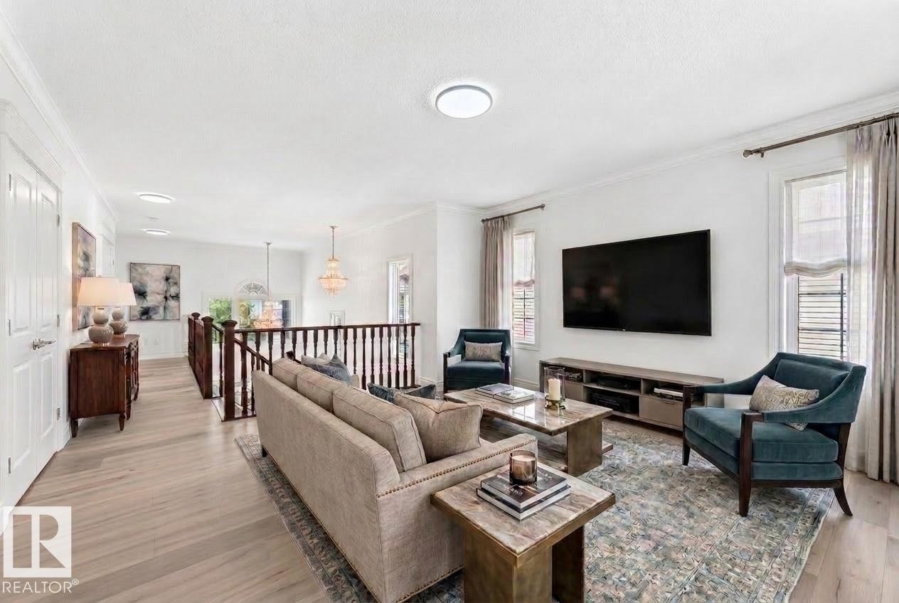 Open-concept living area featuring light wood-finish flooring, white walls, and recessed lighting - 1663 Rutherford Road Sw, Edmonton, AB - Indoor Photo Showing Living Room