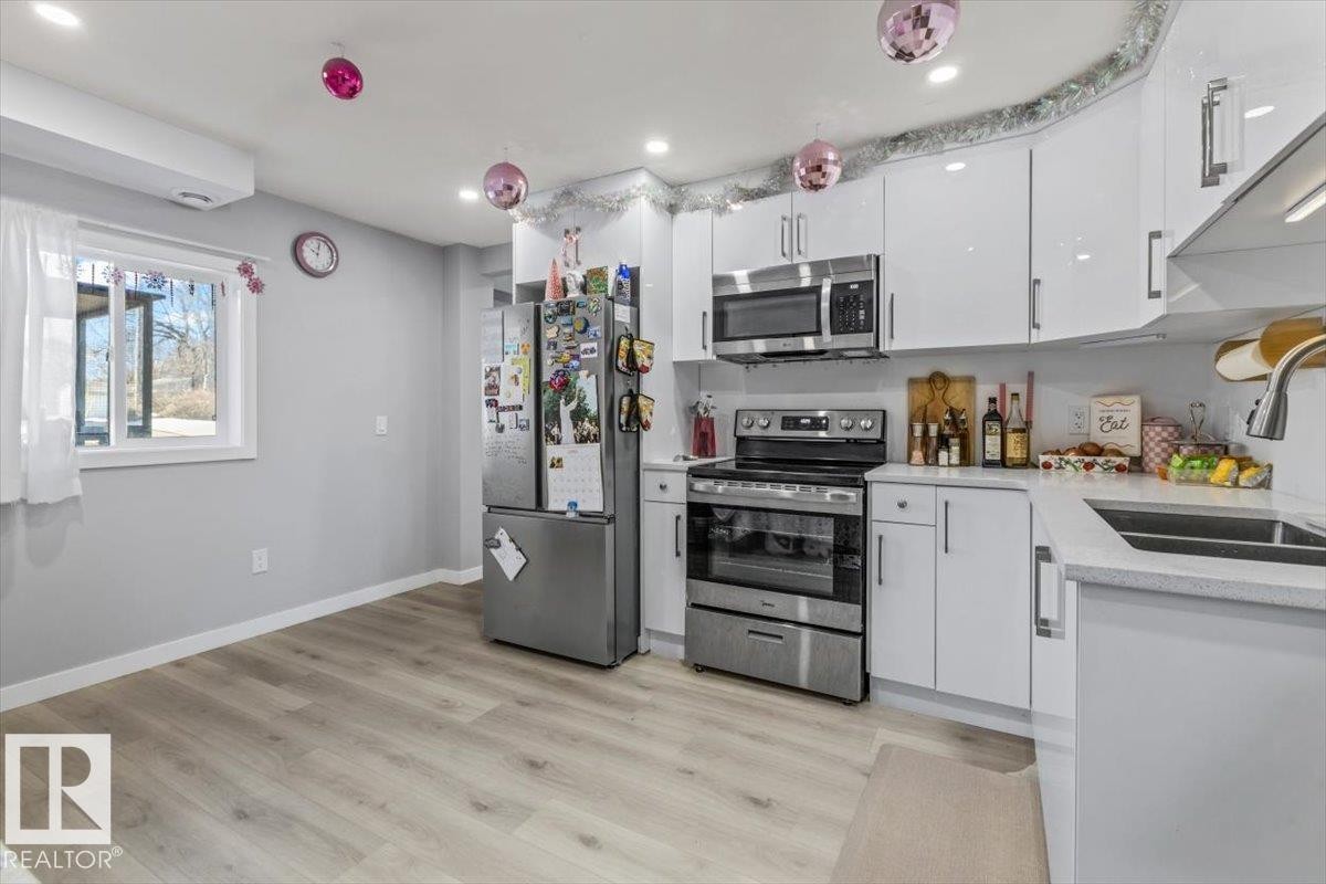 9304 128A Avenue Nw, Edmonton, AB - Indoor Photo Showing Kitchen With Stainless Steel Kitchen With Double Sink