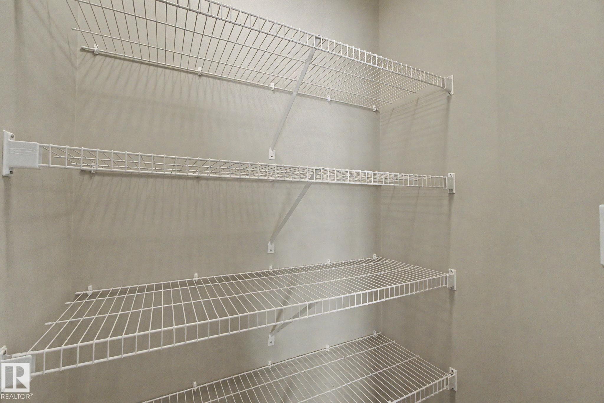 White wire shelving system - 315 Watt Boulevard Sw, Edmonton, AB - Indoor With Storage