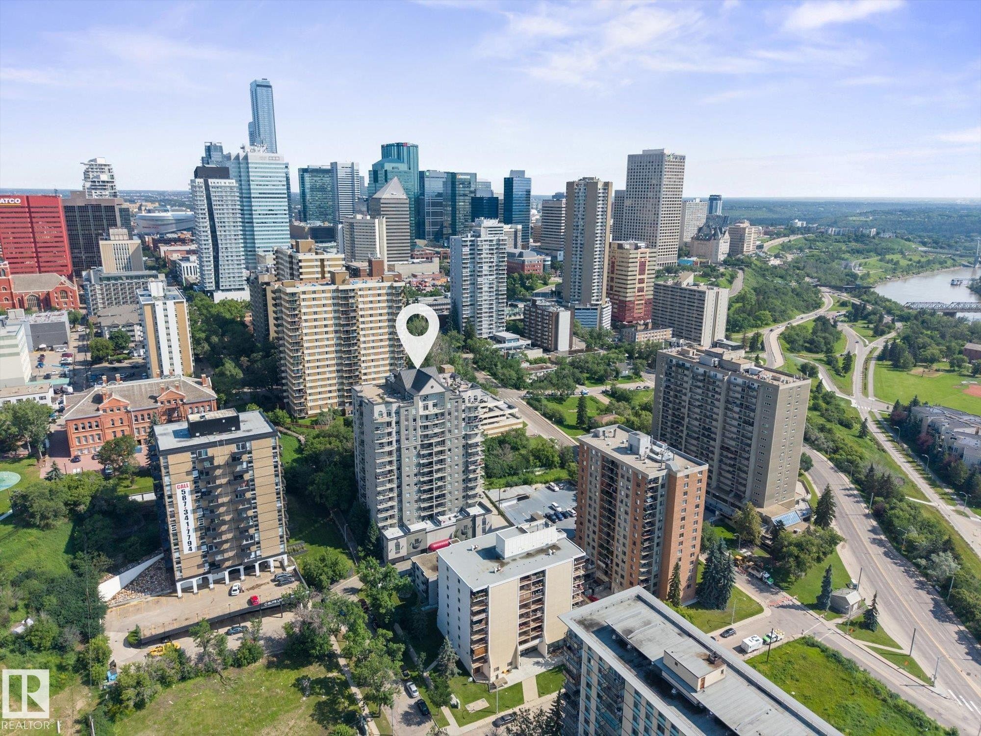 High-rise residential building featuring multiple balconies and a pointed roofline - #707 9819 104 St Nw, Edmonton, AB