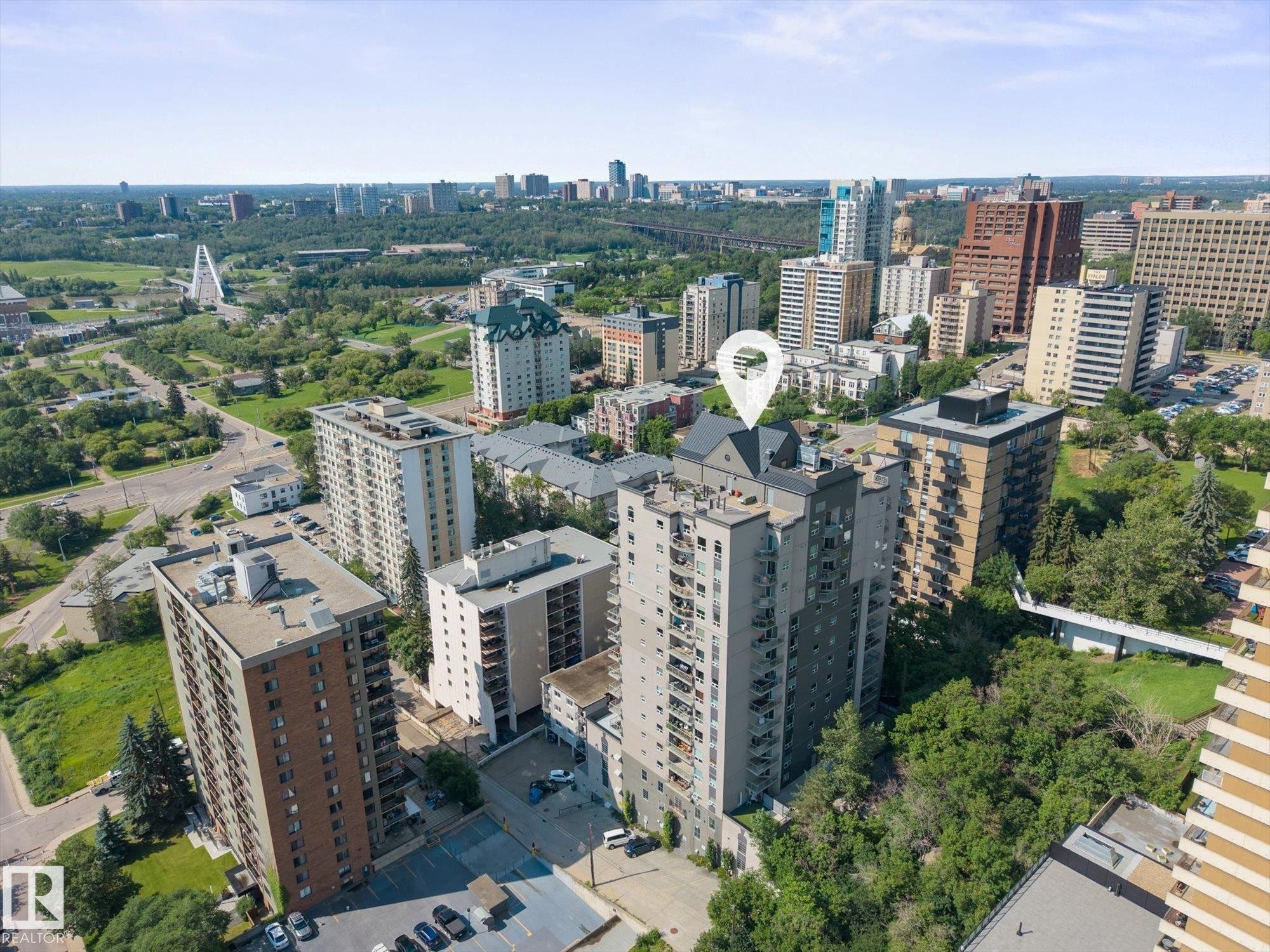 Elevated urban setting featuring a multi-story residential building with balconies - #707 9819 104 St Nw, Edmonton, AB