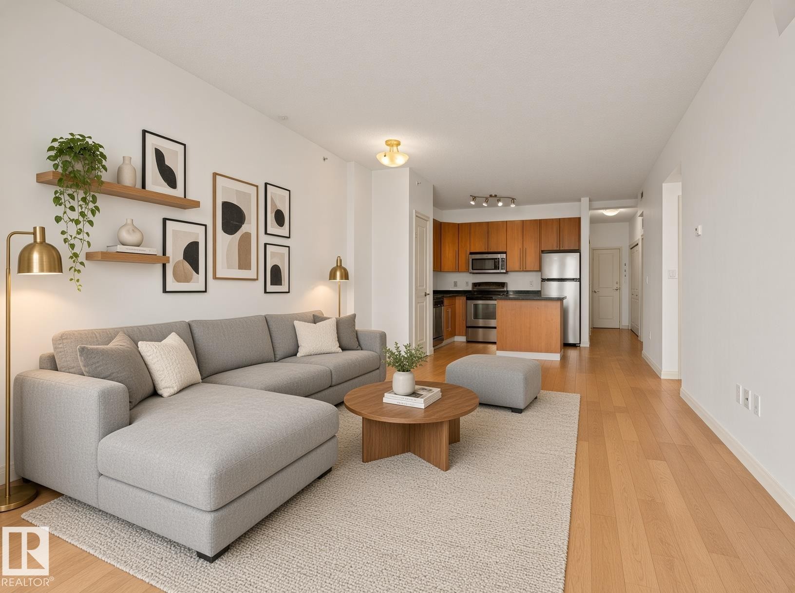 Open-concept living space with wood-finish flooring - #707 9819 104 St Nw, Edmonton, AB
