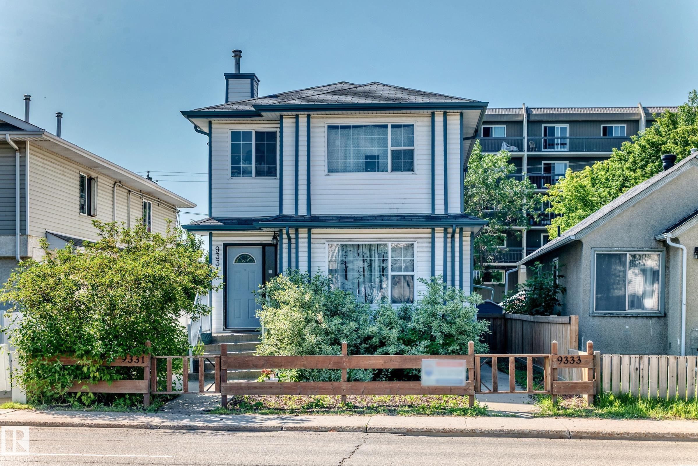 Two-story residence featuring white siding with dark trim accents and a contrasting dark roof - 9333 103A Avenue Nw, Edmonton, AB - Outdoor With Facade