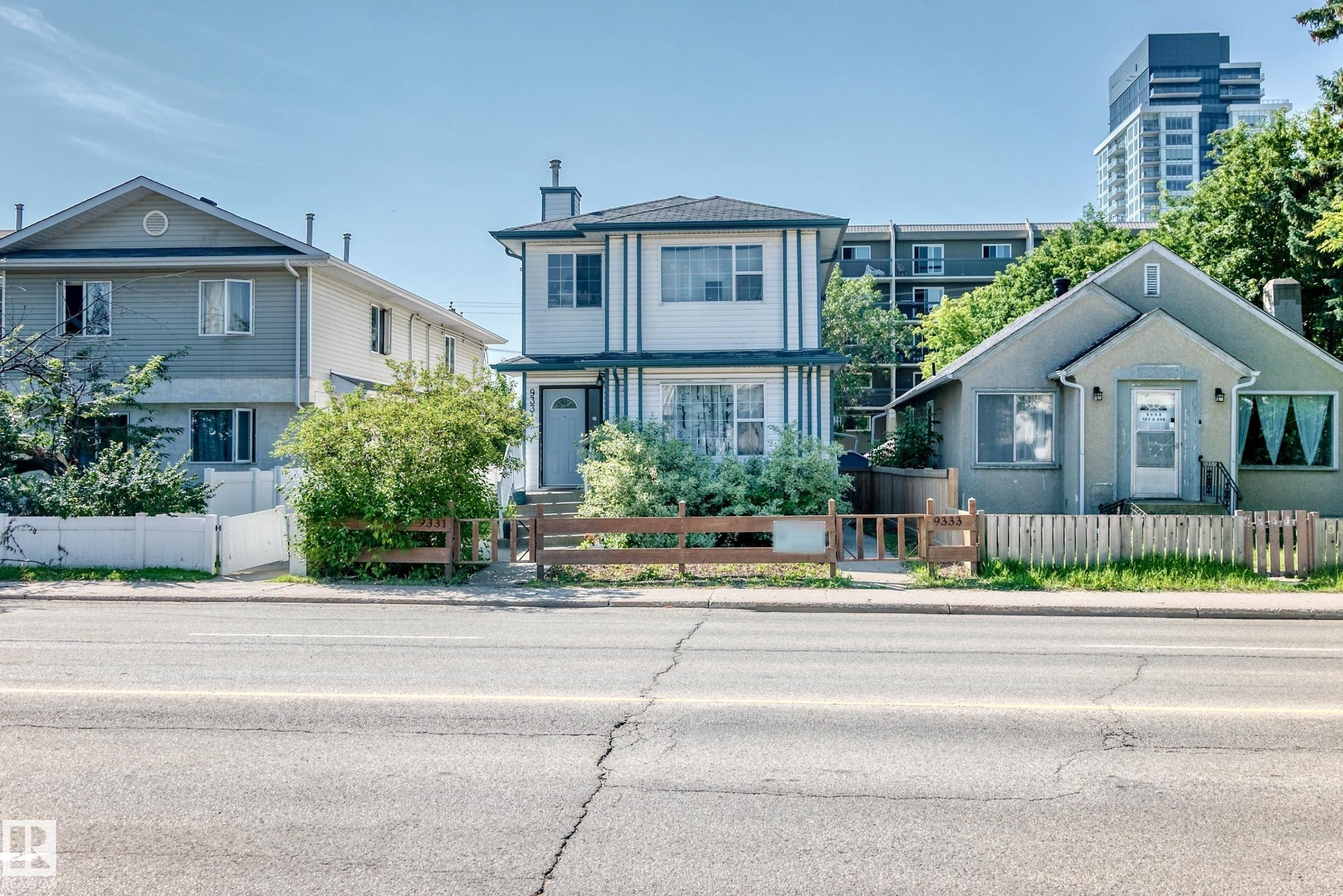 Two-story white exterior with dark trim and a prominent chimney structure - 9333 103A Avenue Nw, Edmonton, AB - Outdoor With Facade